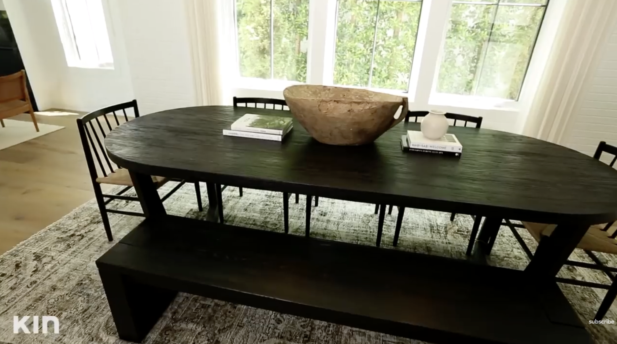 A close-up angle of Tia Mowry's dining table, chairs and rug. | Source: YouTube/Tia Mowry's Quick Fix