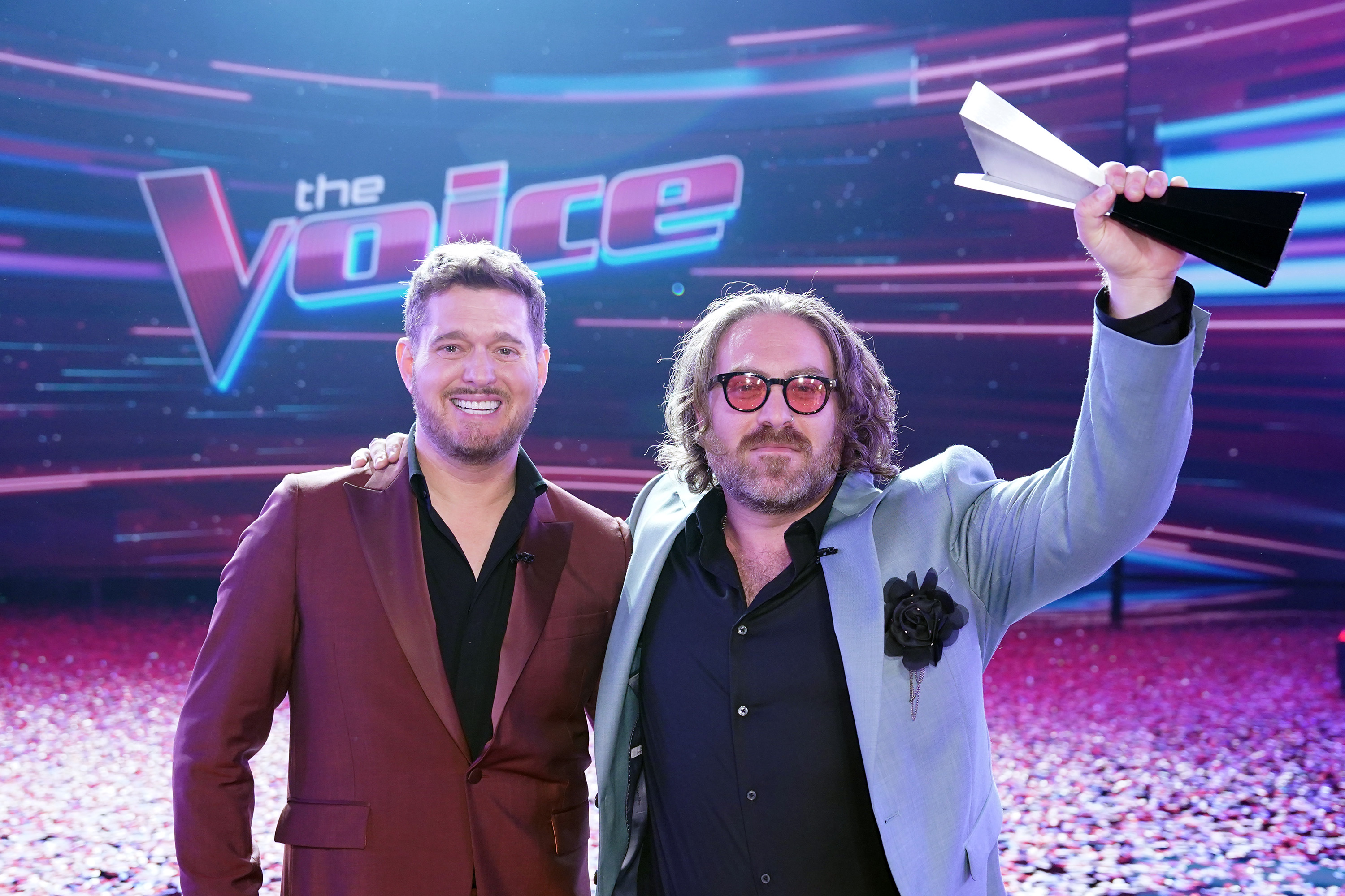 Coach Michael Bublé stands with Adam David following Team Bublé’s second consecutive win during the finale of "The Voice" on March 20, 2025 | Source: Getty Images