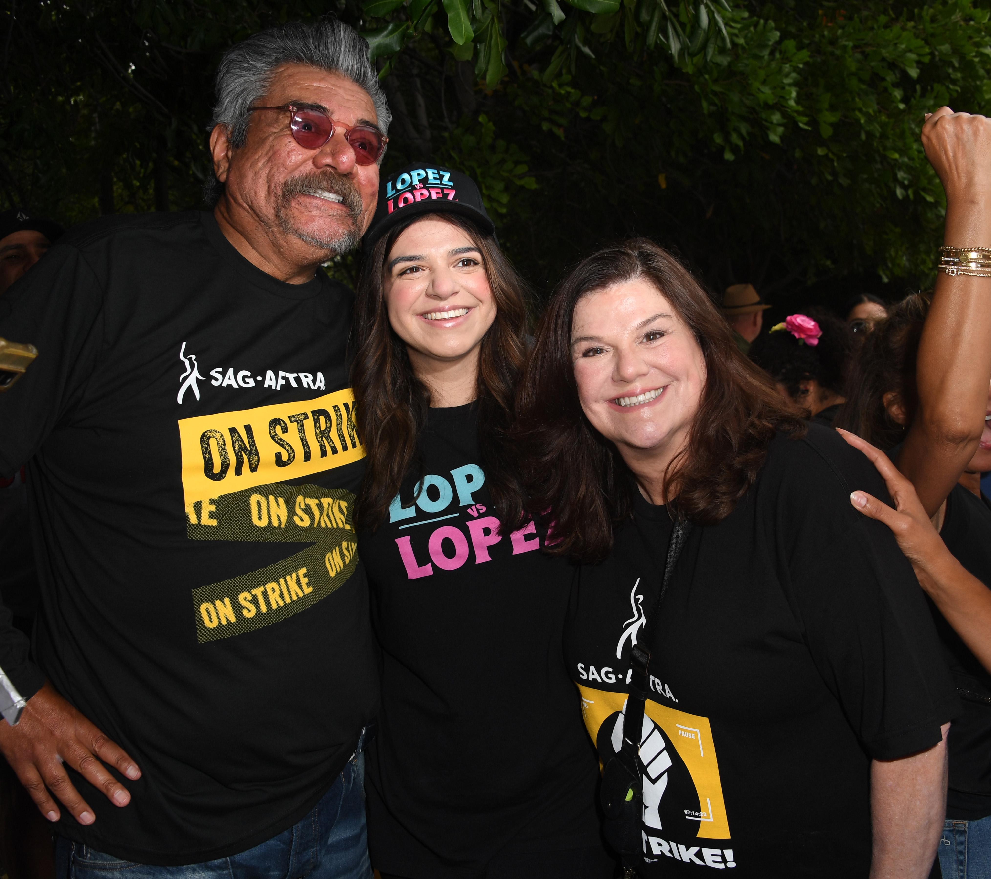 George Lopez, Mayan Lopez and Ann Serrano join the picket line outside Warner Bros. Studios on September 15, 2023, in Burbank, California.