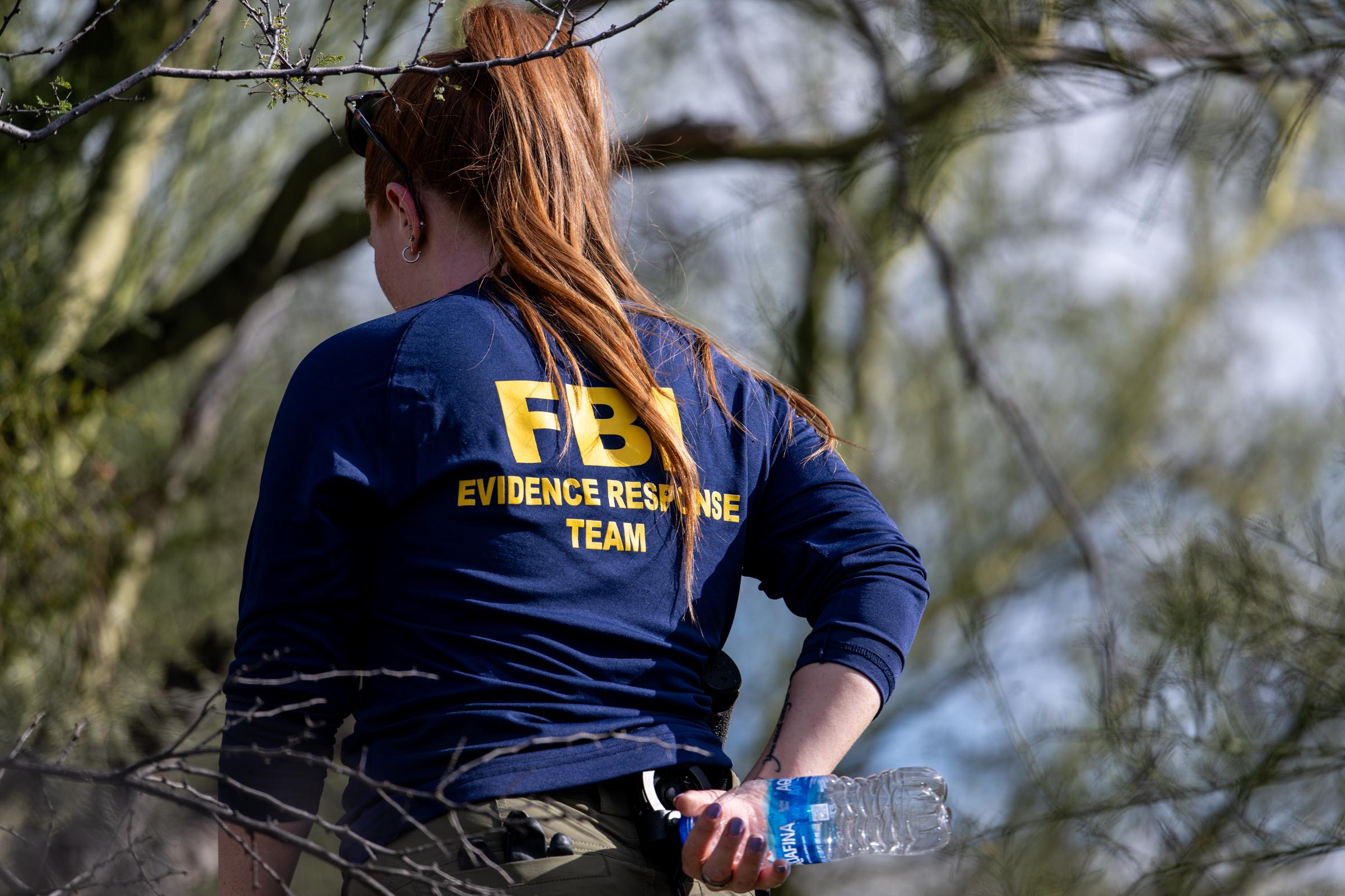 As the search stretched on, federal investigators combed areas around Nancy's home for physical clues that could move the case forward. The investigation increasingly depended on small traces — from DNA to surveillance footage — that might connect the masked subject to the scene. | Source: Getty Images