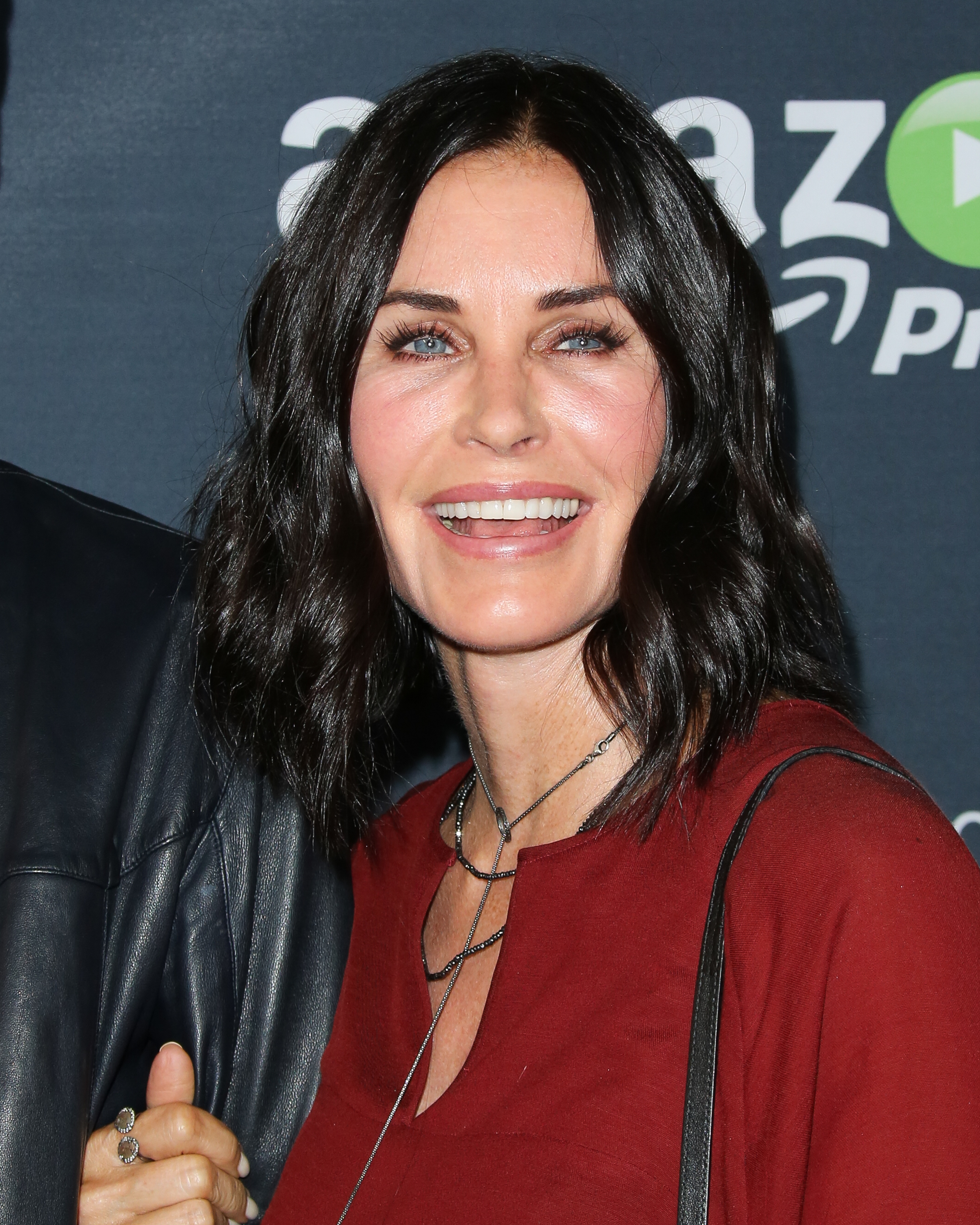 Courteney Cox turns heads at Amazon's "Hand of God" premiere in Los Angeles, sparking speculation about possible cosmetic enhancements.