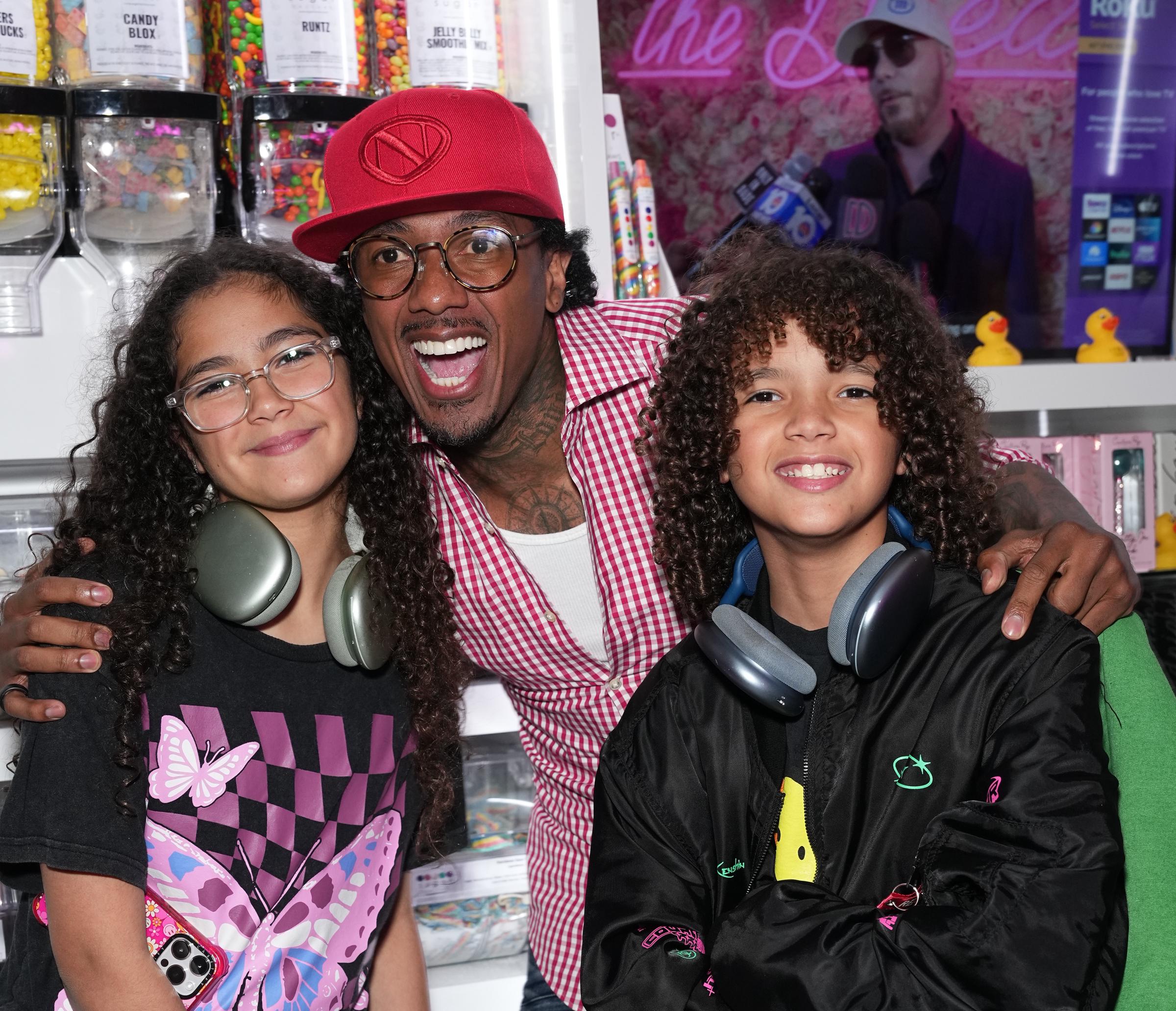 Nick Cannon with Monroe and Moroccan Cannon at Sugar Factory in New York City on August 11, 2023. | Source: Getty Images