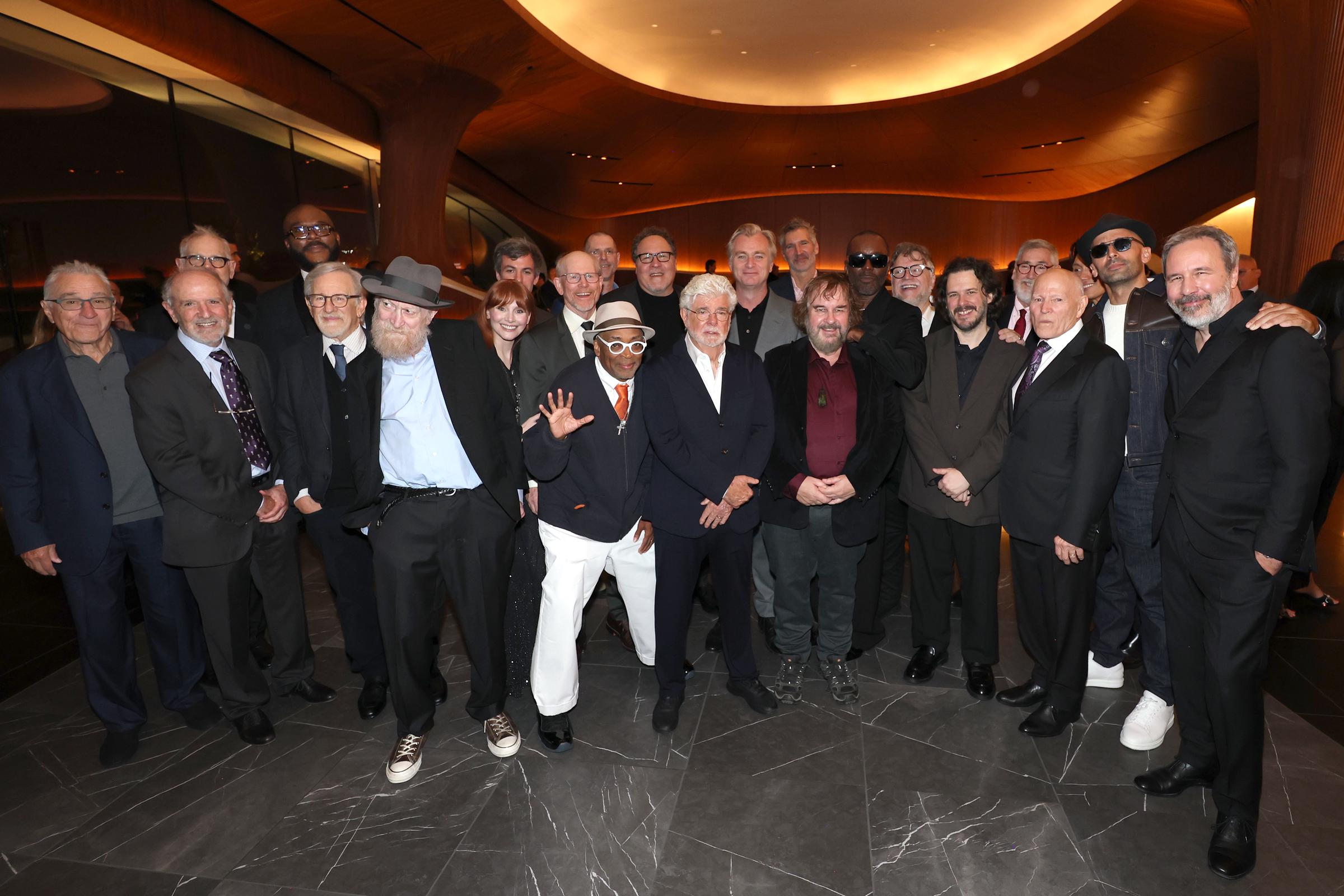 George Lucas joined a large group of filmmakers and other guests for a photograph inside the museum, including Robert De Niro, Steven Spielberg, Spike Lee, Jon Favreau, Christopher Nolan, Peter Jackson, and Guillermo del Toro. The group portrait brought together several generations of figures associated with filmmaking and visual storytelling. | Source: Getty Images