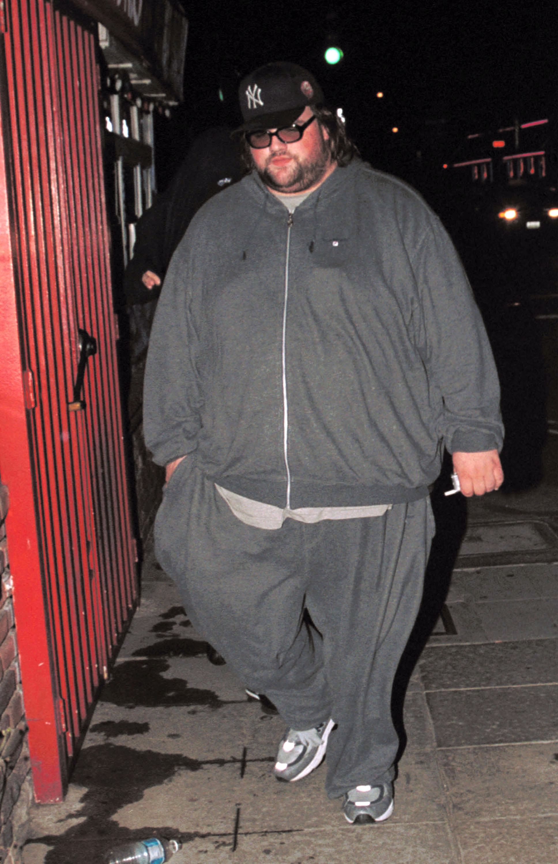 Ethan Suplee was spotted leaving The Standard hotel in Hollywood, California, on April 11, 2002. The photograph offered another candid look at the actor during his heavier years. Wearing a gray tracksuit, sneakers, glasses, and a New York Yankees cap, Suplee was casually dressed for the nighttime outing. The photograph documented his appearance at the time, years before his weight loss would leave some longtime fans struggling to recognize him.