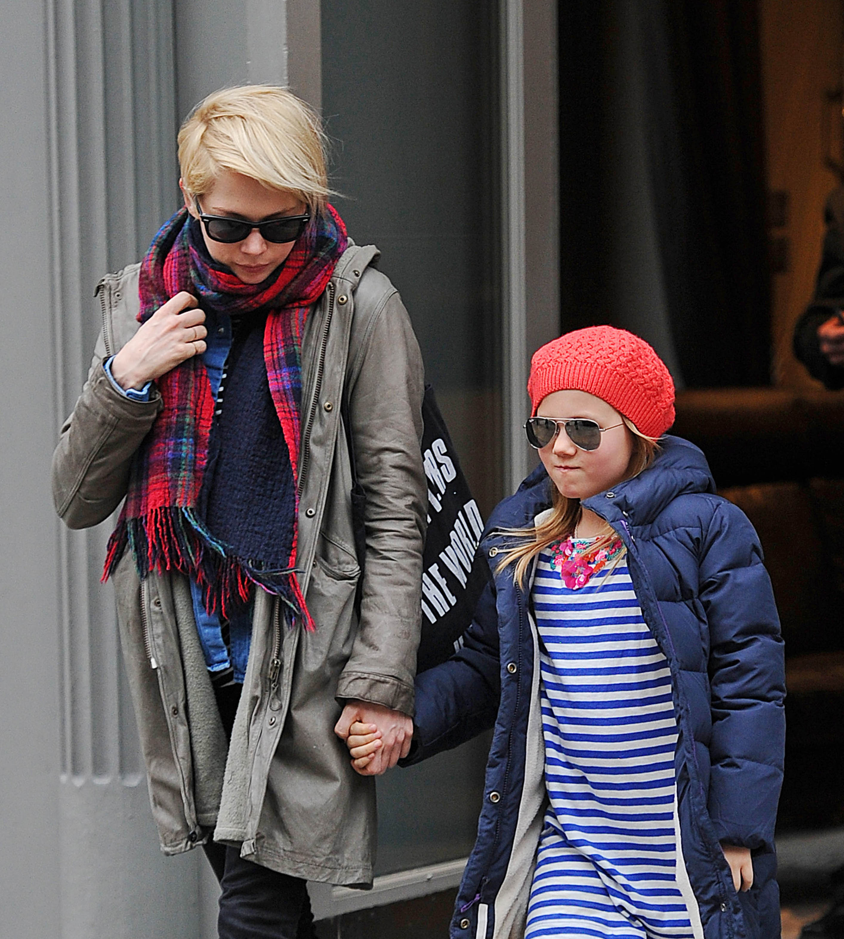 Michelle Williams walks through New York City with daughter Matilda Ledger on March 6, 2013. As Ledger grew older, Williams continued to shield her from the spotlight, prioritizing a stable upbringing while balancing motherhood with her award-winning acting career.
