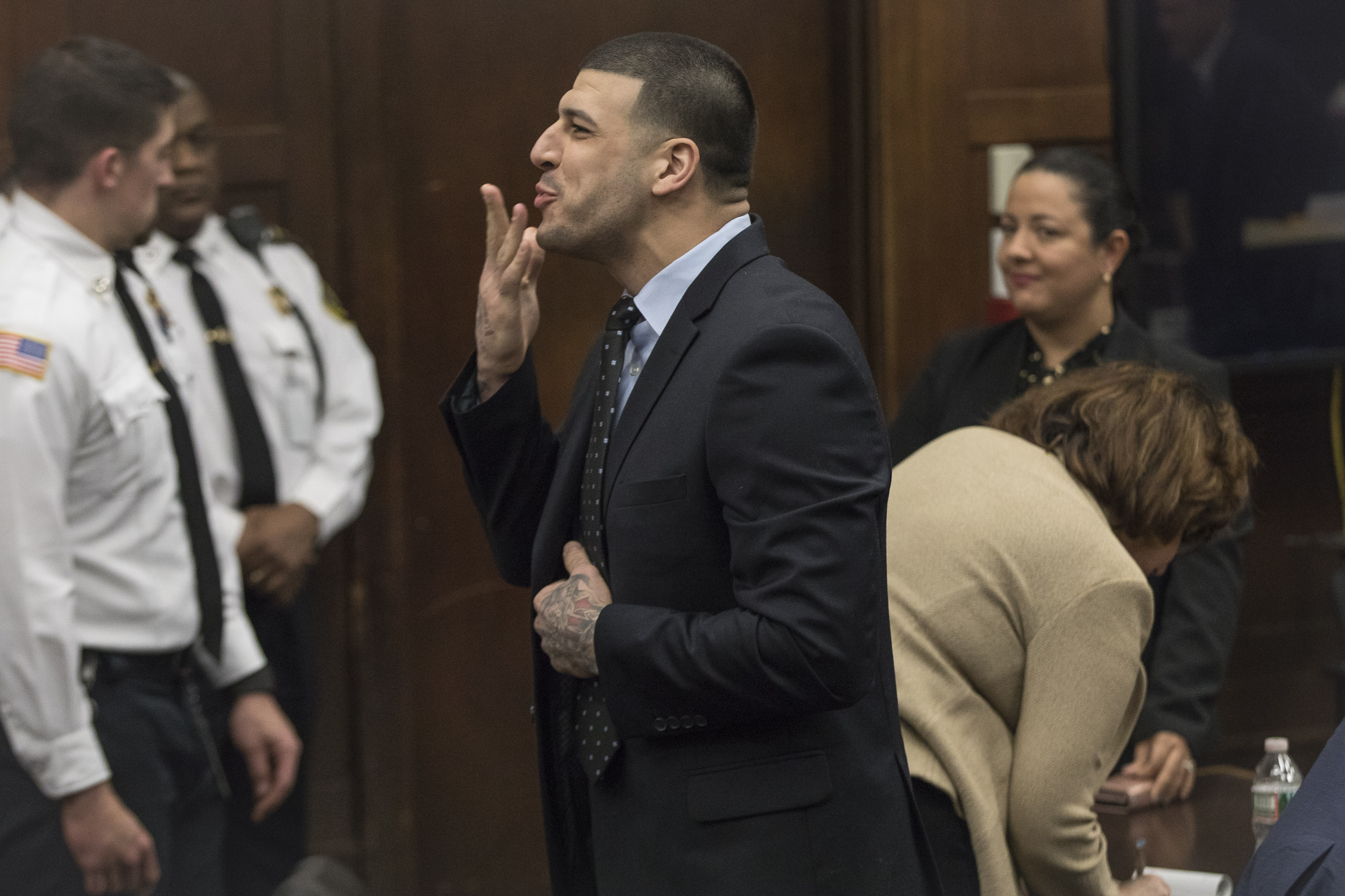 Aaron Hernandez blew a kiss from the defense table during jury deliberations in his double-murder trial at Suffolk Superior Court in Boston, Massachusetts, on April 12, 2017. His fiancée, Shayanna Jenkins-Hernandez, and their four-year-old daughter, Avielle Hernandez, were both in court that day after Avielle had reportedly begged to see him. Aaron was already serving life for Odin Lloyd's murder and would be acquitted in the killings of Daniel de Abreu and Safiro Furtado two days later.