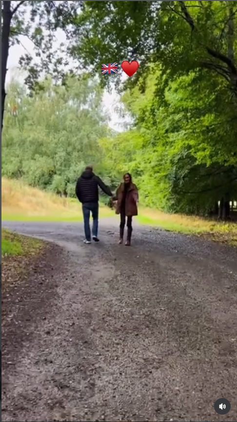 Harry and Meghan appear relaxed as they walk hand in hand through the leafy countryside, offering one of the more intimate moments from the family's British getaway. The quiet scene contrasts with the buzz that followed over a brief moment elsewhere in the video, when viewers began closely listening to Archie. | Source: Instagram/meghan