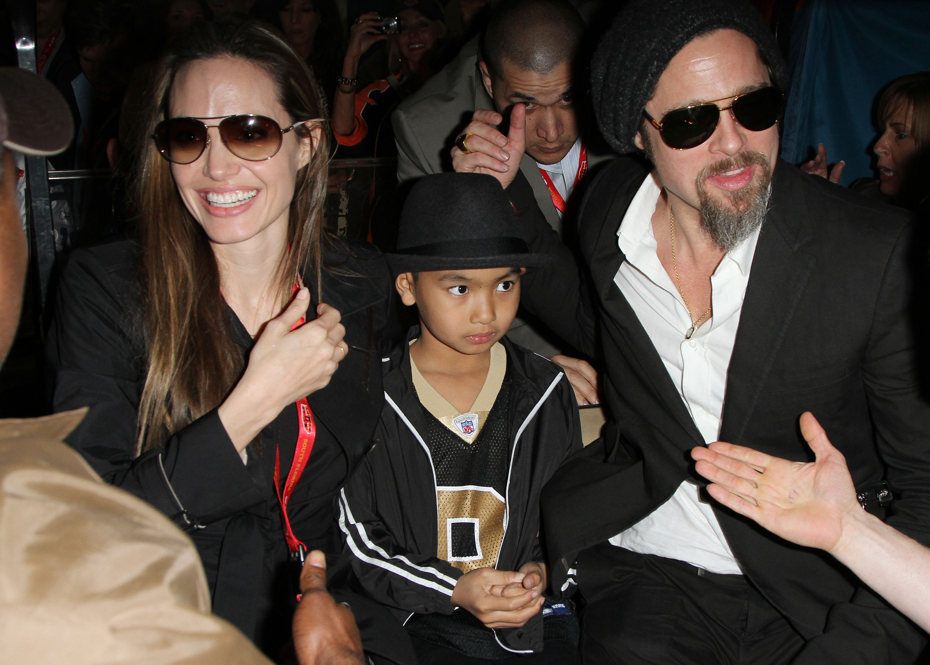 Angelina Jolie, Maddox, and Brad Pitt are seen leaving Super Bowl XLIV on February 7, 2010 in Miami Gardens, Florida | Source: Getty Images