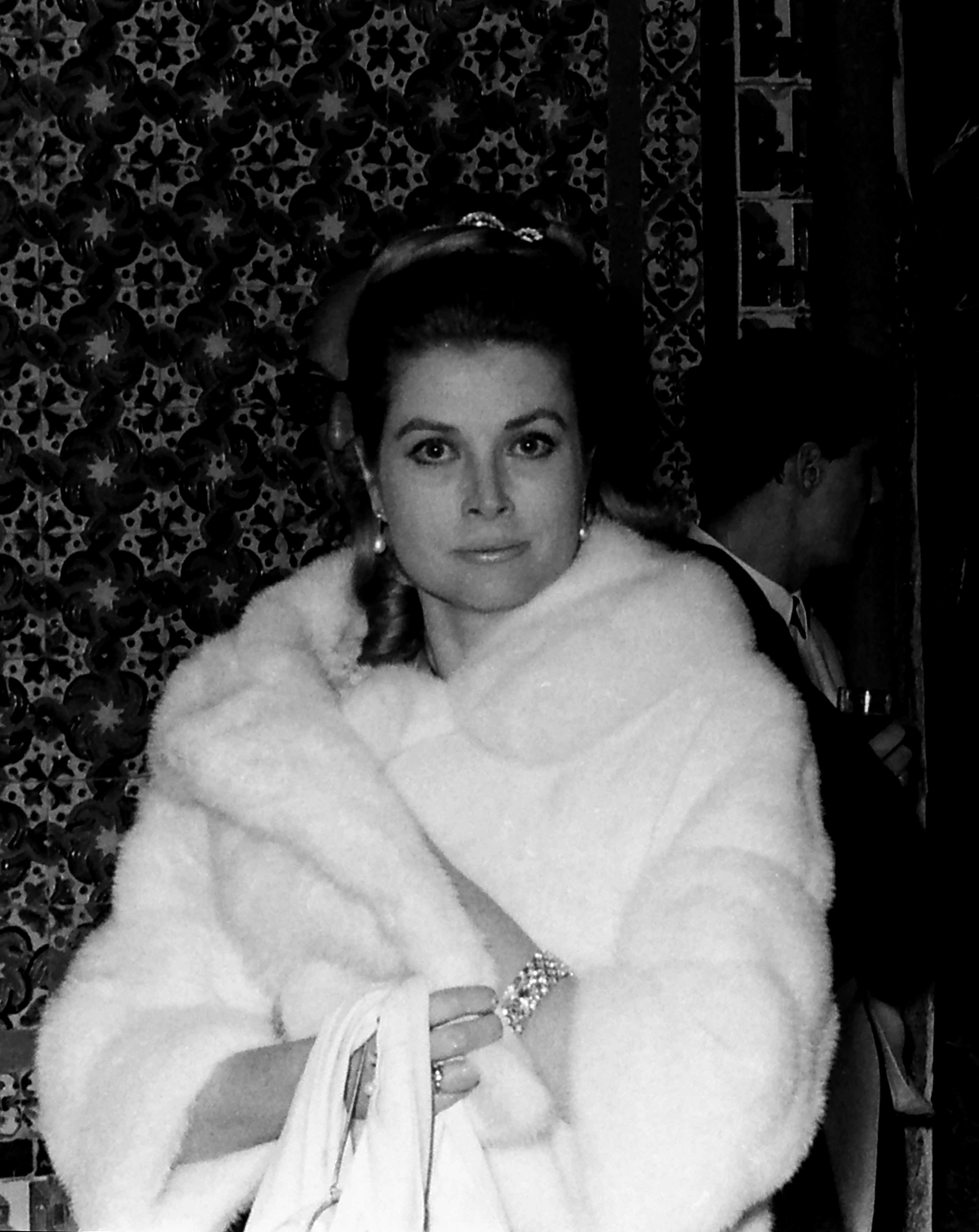 Grace Kelly during a formal public appearance in Seville, Spain, photographed in a composed, formal setting | Source: Getty Images