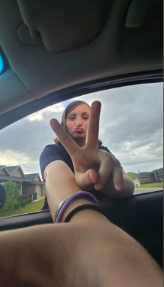 Danika Troy flashing a peace sign for the camera, posted on December 4, 2025. | Source: GoFundMe/Lena Ryberg