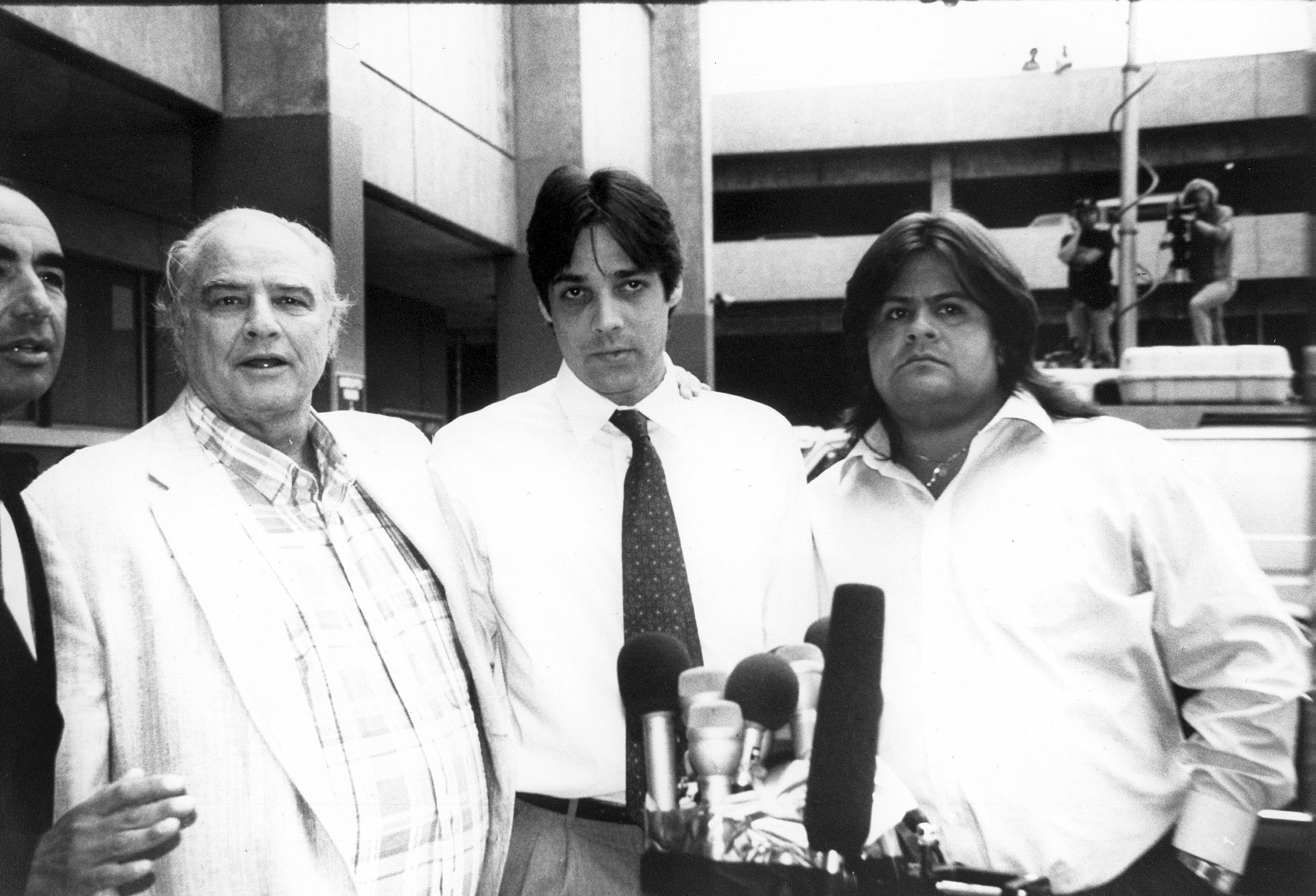 Marlon Brando and his sons leaving the Los Angeles courthouse in an undated photograph. | Source: Getty Images