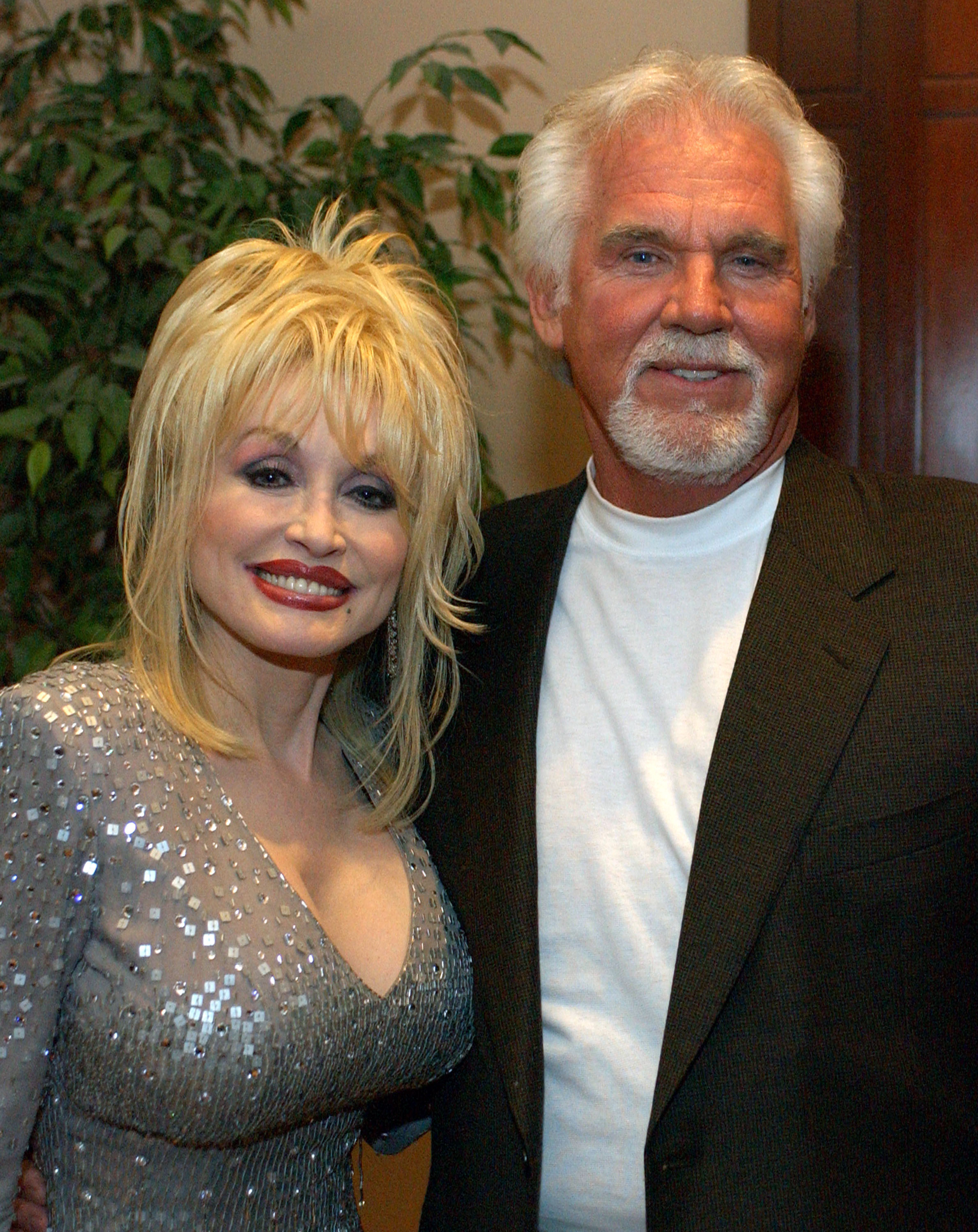 Dolly Parton and Kenny Rogers at G-CAPP'S "The Retro Premier" of 9 to 5- Live Auction in 2003. | Source: Getty Images