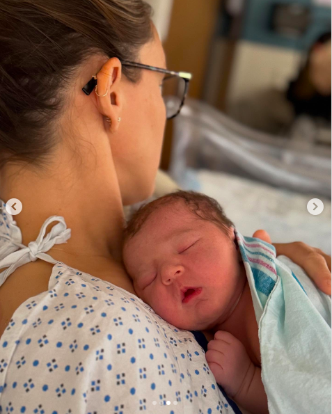 Kylie Kelce gently cradling Finnley "Finn" Anne Kelce on her chest. | Instagram/kykelce