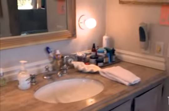 The single sink vanity where Rinna revealed her daughters famously fought while brushing their teeth at the same time. | Source: YouTube/@Biography