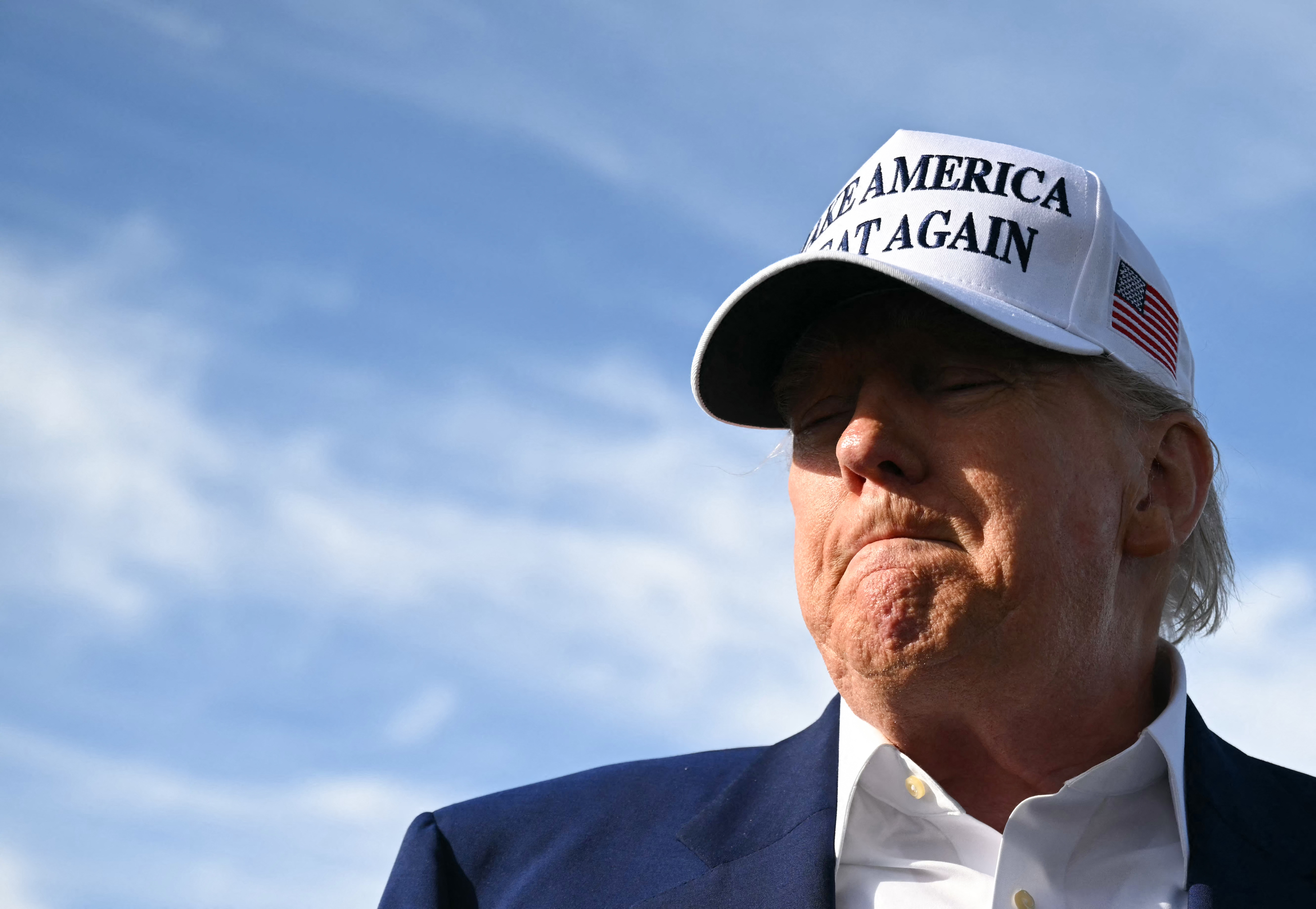 President Donald Trump speaks to journalists before boarding Air Force One from Morristown Municipal Airport in Morristown, New Jersey, May 25, 2025, after spending the weekend in New Jersey. | Source: Getty Images
