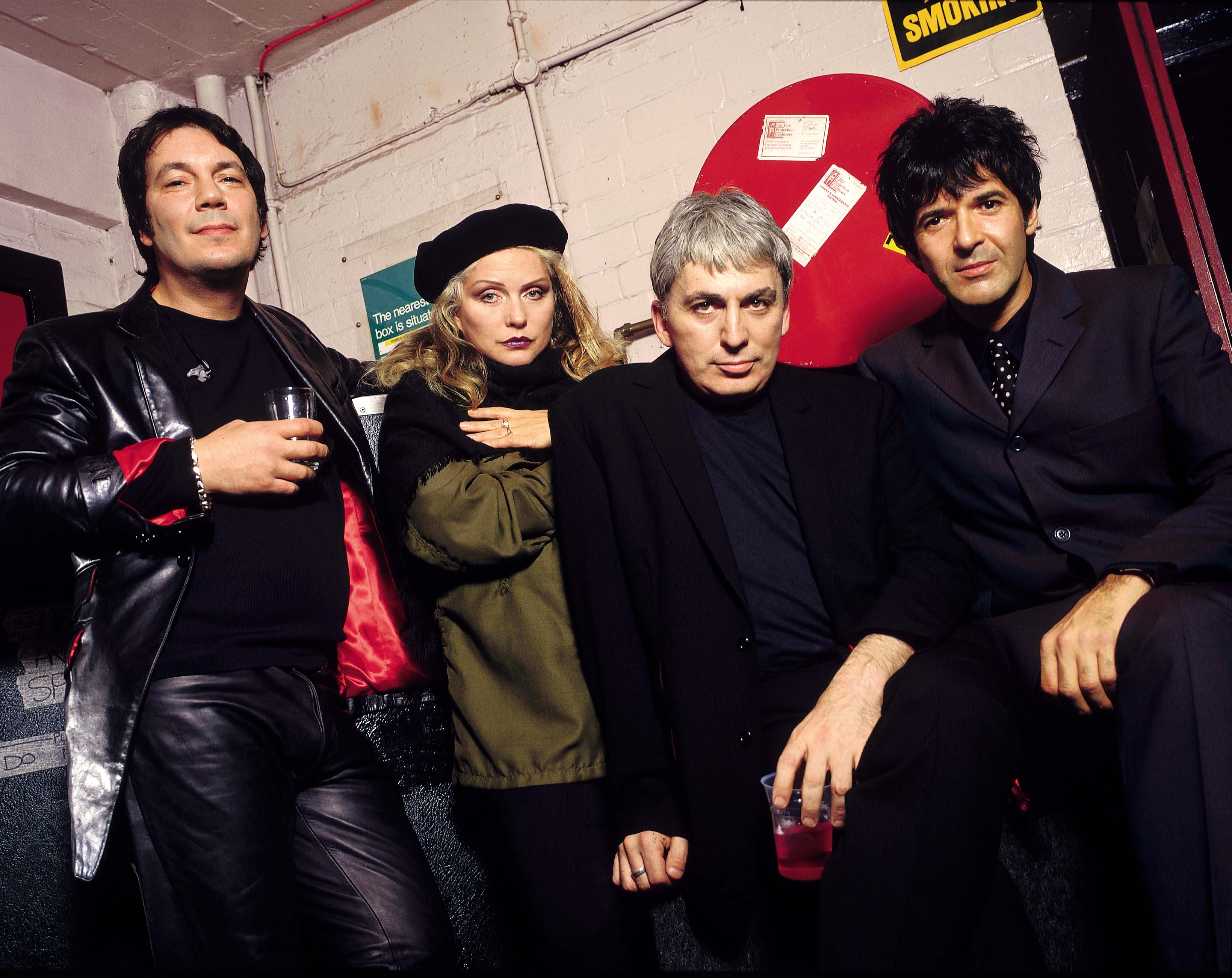 The punk rock icon photographed with her band in 1998. | Source: Getty Images