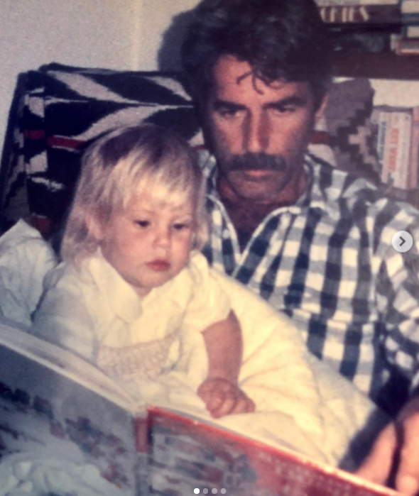 In a sweet throwback snapshot shared to social media, the acclaimed actor bonded with his toddler daughter during storytime. Cuddled up together in bed, the future musician looked adorable with blonde bangs in a pale dress while her famous father, sporting his trademark mustache and a classic checkered button-down shirt, held open a storybook for them to read. | Source: Instagram/cleoroseelliott