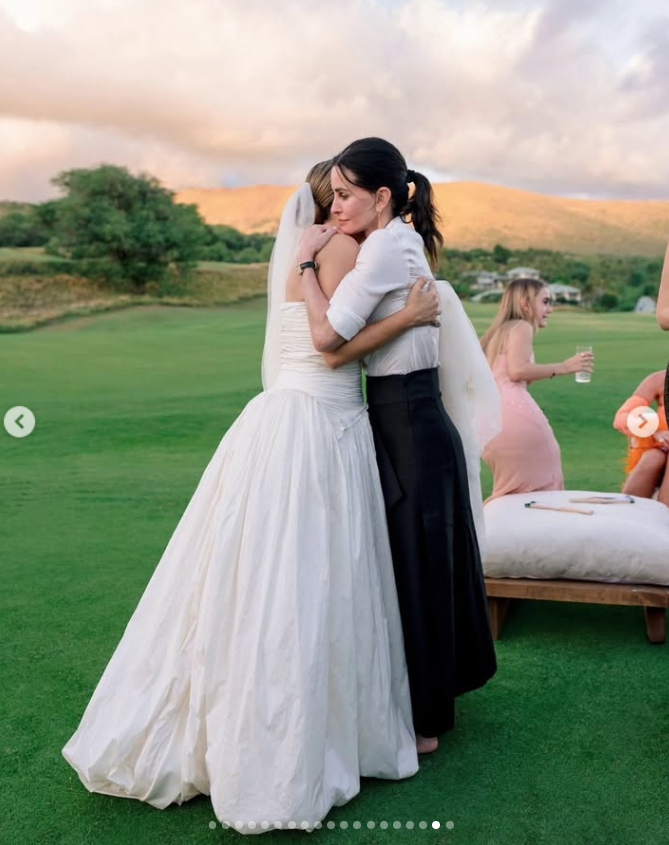 Courteney Cox shares a warm embrace with bride Jennifer Meyer during her Hawaiian wedding celebration. | Source: Instagram/jenmeyerjewelry and jennifermeyer