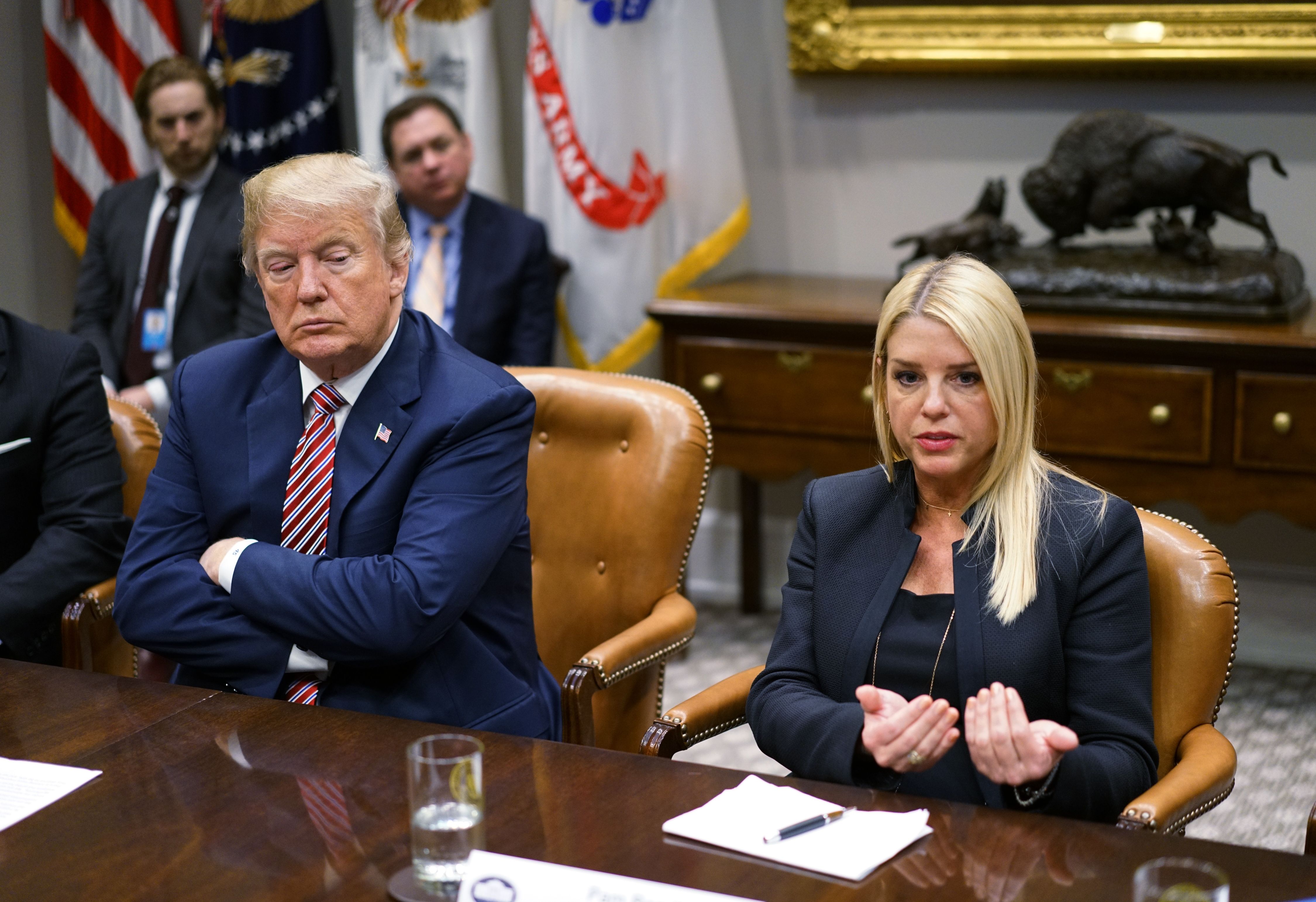 Then-Florida Attorney General Pam Bondi speaks during a meeting on school safety as President Donald Trump listens in the Roosevelt Room of the White House in Washington, D.C., February 22, 2018 | Source: Getty Images