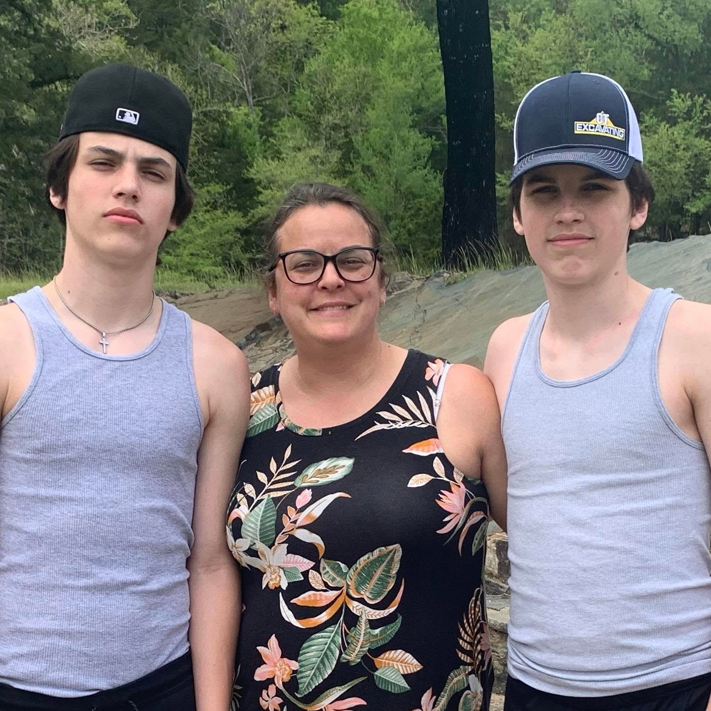 Meghan Metcalf pictured with Hunter and Austin, from a post dated May 2022 | Source: Facebook/meghan.p.metcalf