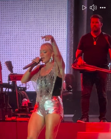 Carrie Underwood performs "Before He Cheats" at last summer's Pro Football Hall of Fame, as seen from a video post dated November 30, 2025.| Source: Facebook/thecountrywire