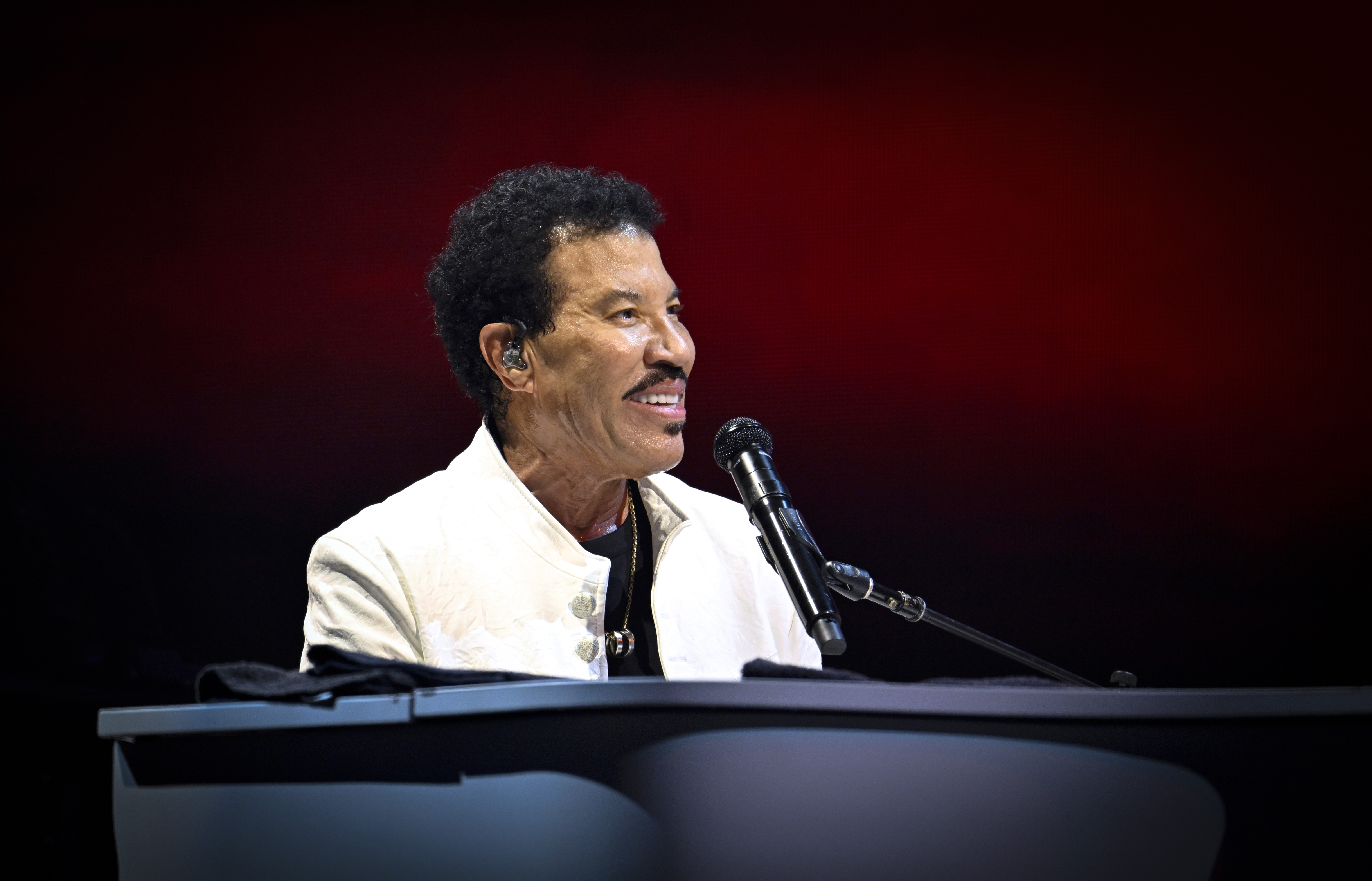 Richie performs during his tour opening in Belfast in May 2025. More than a year later, he told The Muny crowd that he had returned to his doctor for answers and learned he was suffering from dehydration. | Source: Getty Images