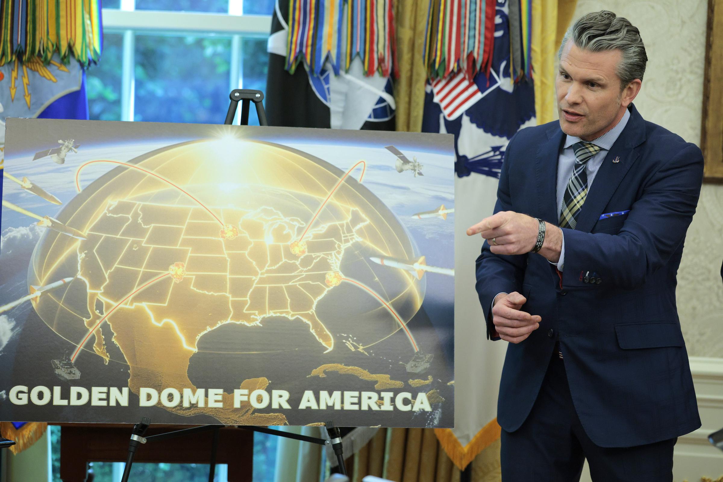 Secretary of Defense Pete Hegseth points to a Golden Dome missile defense diagram during a presentation in the Oval Office on May 20, 2025 | Source: Getty Images