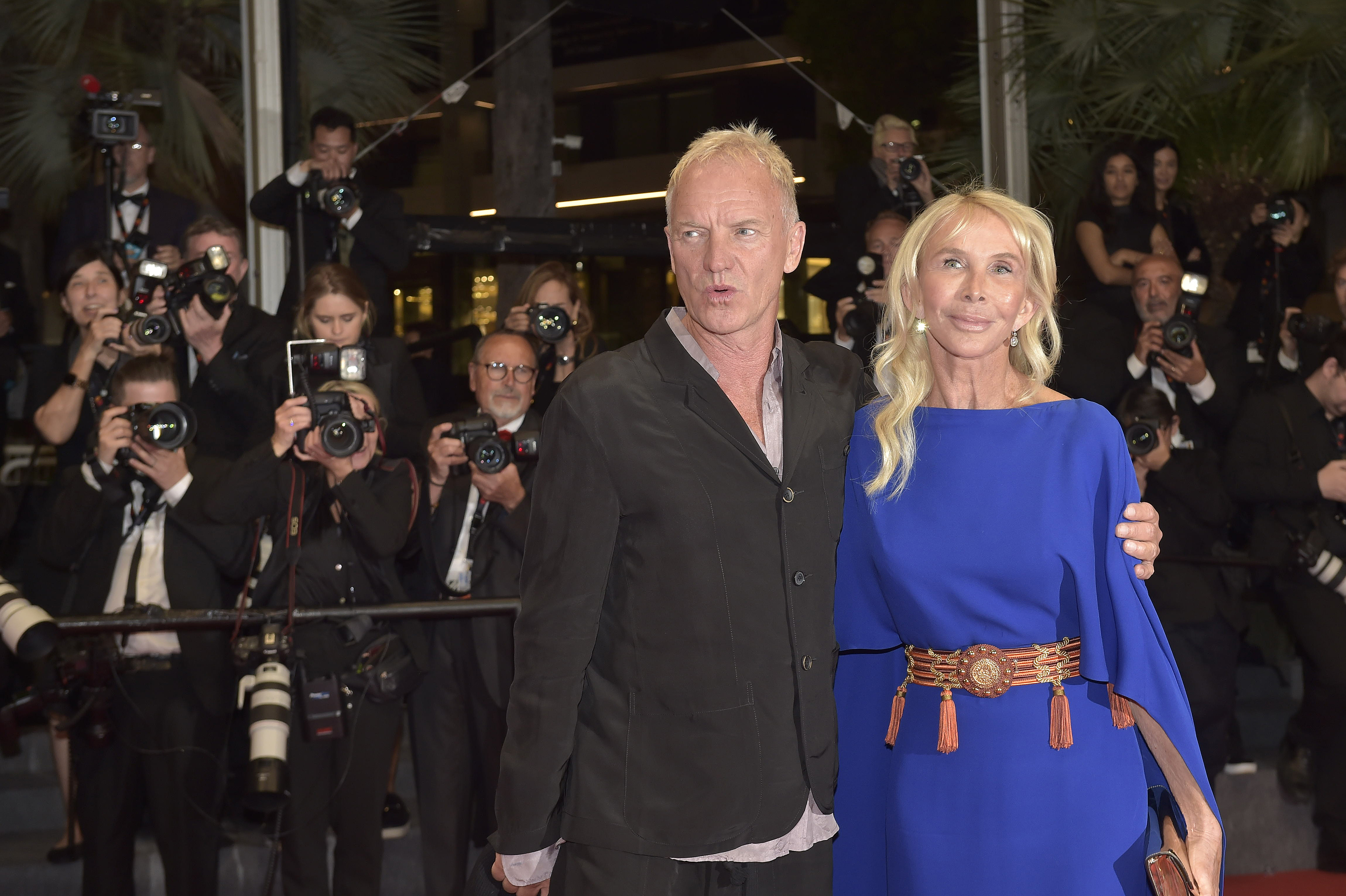 Trudie Styler, at 70, showed a smooth, slightly rigid complexion across her cheeks, a subtle unevenness to her jawline that pulled the corner of her mouth, and long, natural blonde hair styled with volume, while attending the "Parthenope" Red Carpet with Sting on May 21, 2024, at the Cannes Film Festival in Cannes, France.