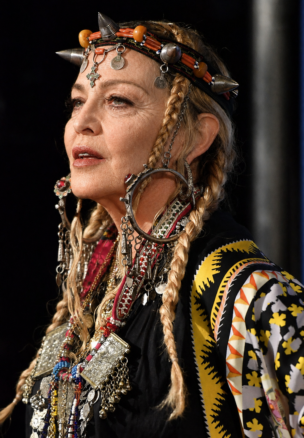 Seen through the AI treatment, the same profile and elaborate styling remain while Madonna's facial appearance takes on a different look. | Source: Chat GPT
