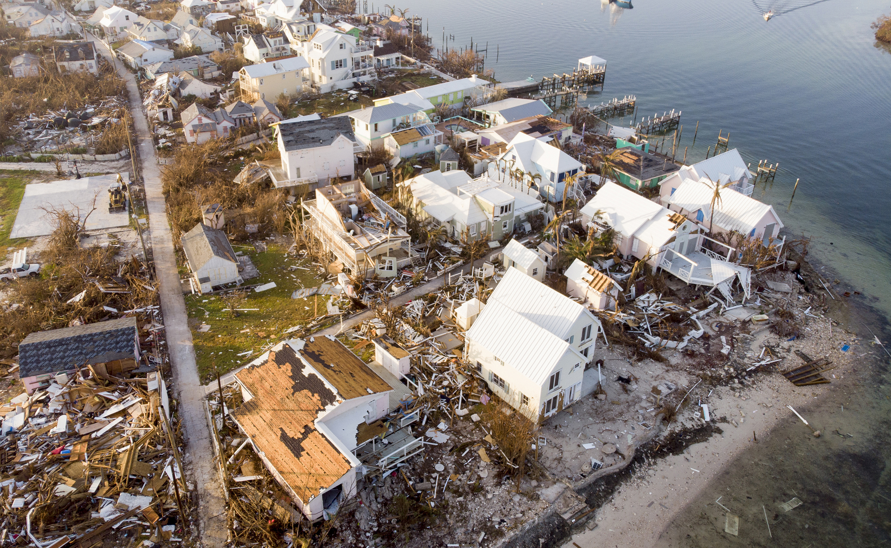 Rising storm surge and hurricane-force winds can leave coastal communities in complete ruin, ripping away roofs and scattering debris along flooded shorelines. | Source: Getty Image