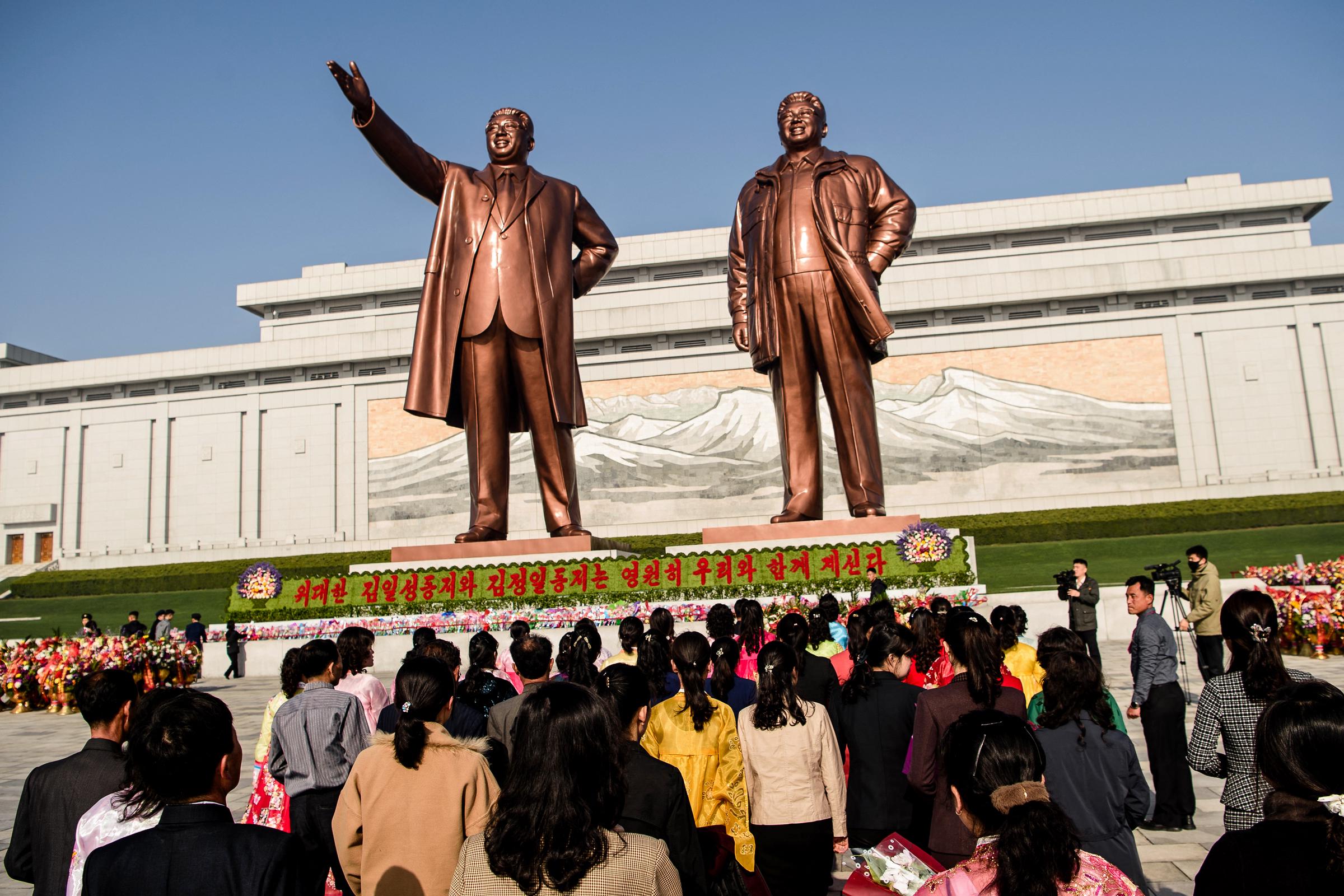 People pay tribute to Kim Il Sung and Kim Jong Il's statues in Pyongyang on April 15, 2025, for Kim Il Sung's 113th birthday. | Source: Getty Images