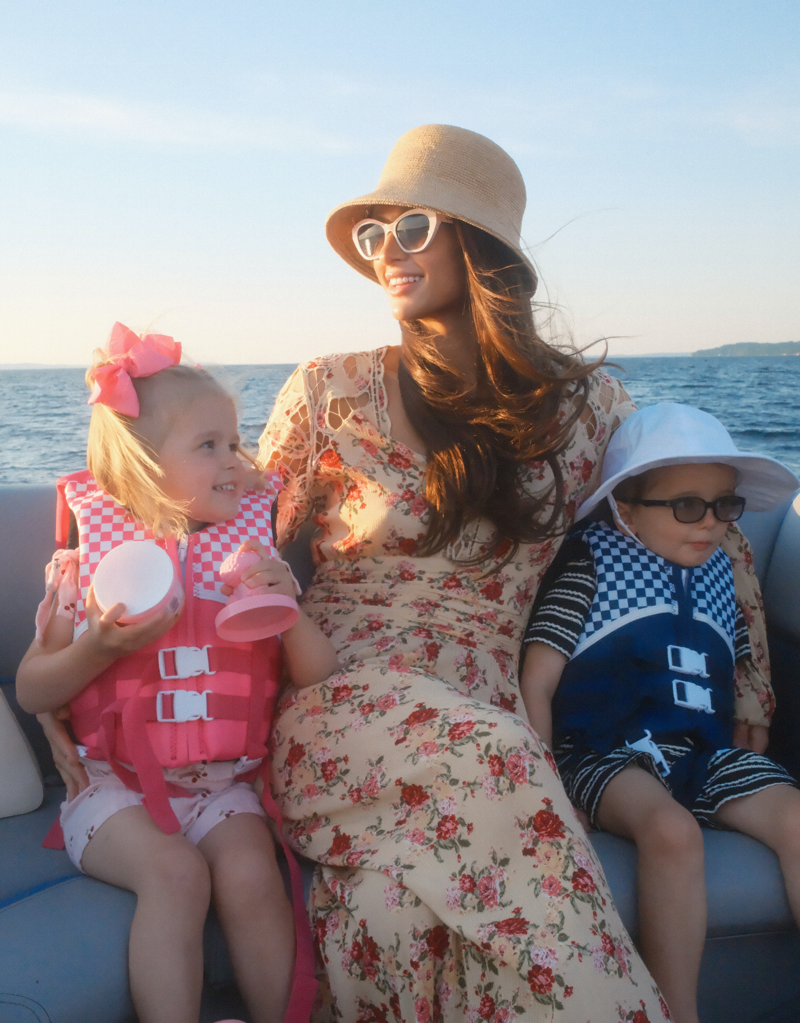 The boat trip offered the family a quieter break from the rides and crowded festival grounds. Paris's darker waves remained one of the most noticeable details throughout the carousel. | Source: Instagram/parishilton