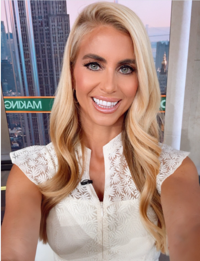 Katie Zacharia smiles for a photo in a white patterned sleeveless outfit, with her long blonde hair falling in loose waves. Before her latest appointment, she had already gained experience in political communications and built connections with Pepperdine University. | Source: Instagram/katiezacharia