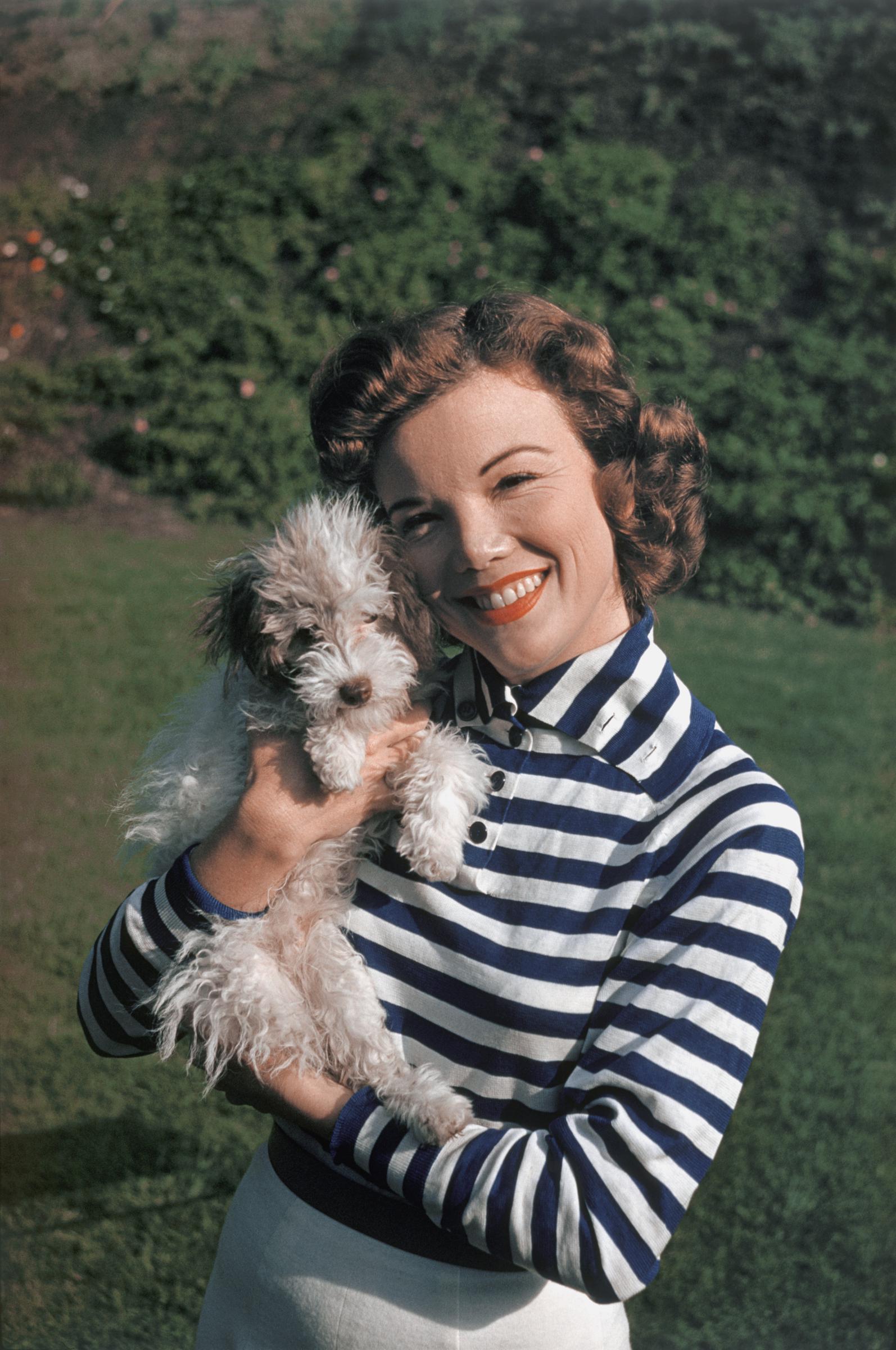 Nanette Fabray during a portrait session while playing with her dog at home circa 1959 | Source: Getty Images