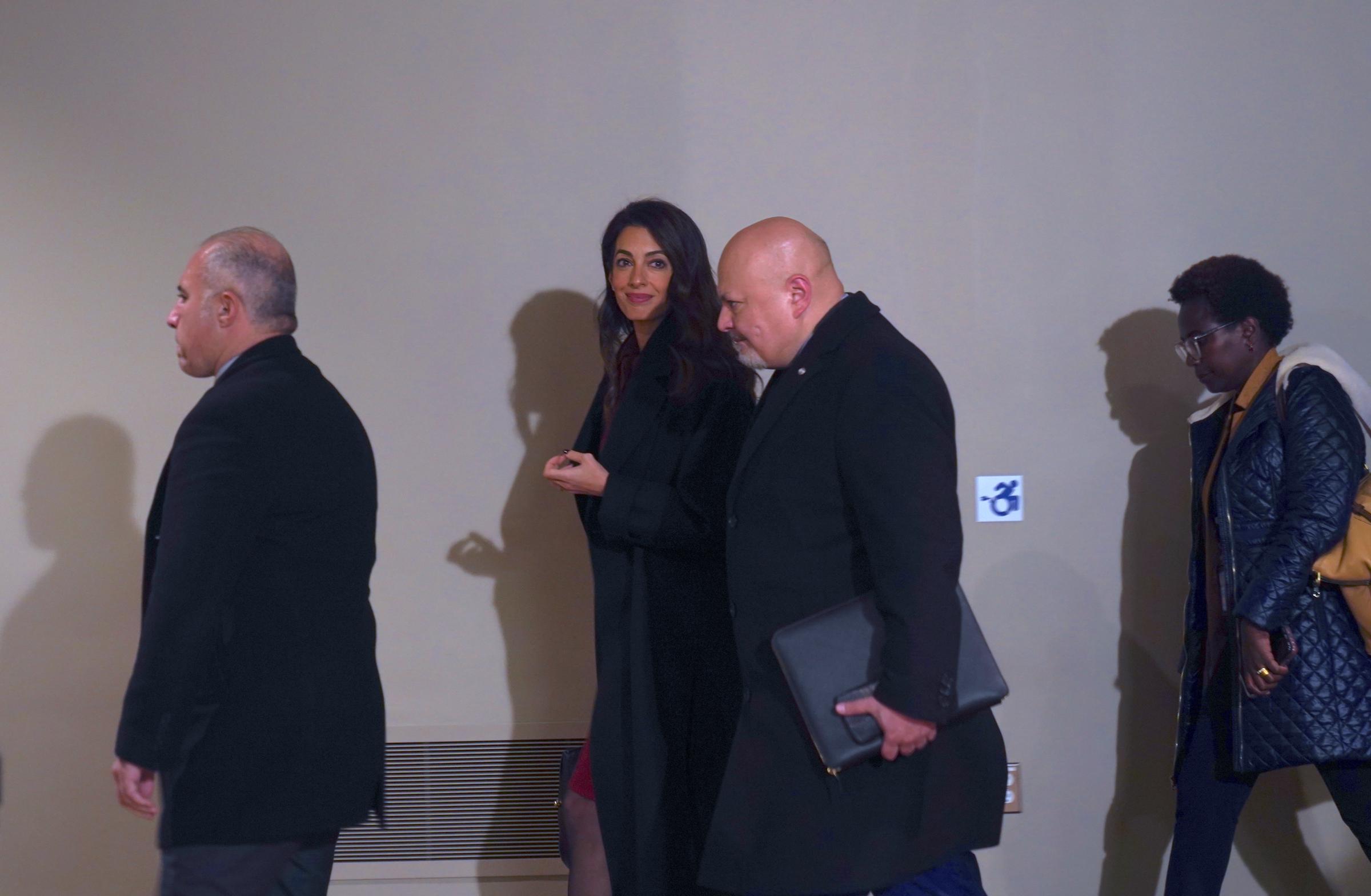 The International Criminal Court (ICC) Presecutor Karim Khan KC (C - R) and his Special Adviser on Darfur, Amal Clooney (C - L), are seen after the United Nations Security Council meeting at the United Nations Headquarter on January 25, 2023, in New York. | Source: Getty Images
