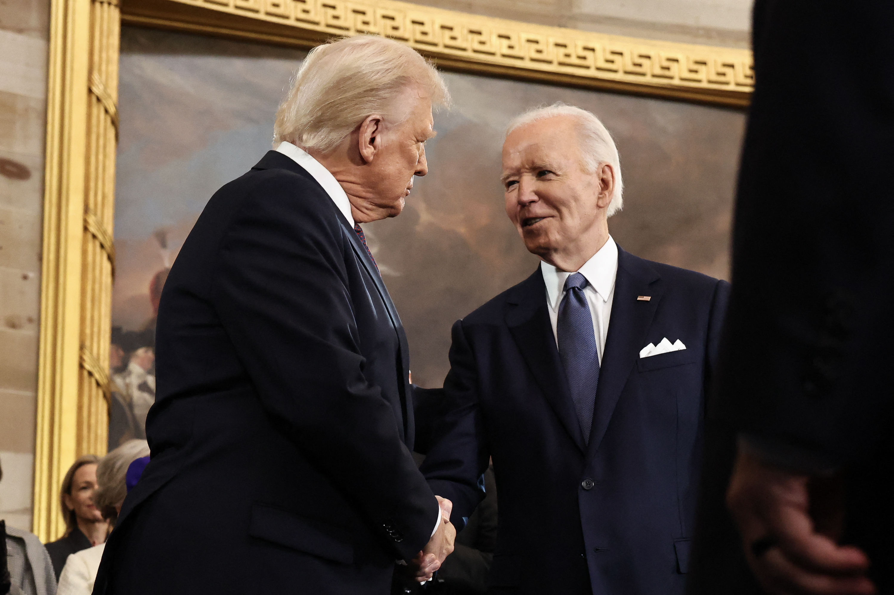 Donald Trump greets President Joe Biden on January 20, 2025, in Washington, D.C. | Source: Getty Images