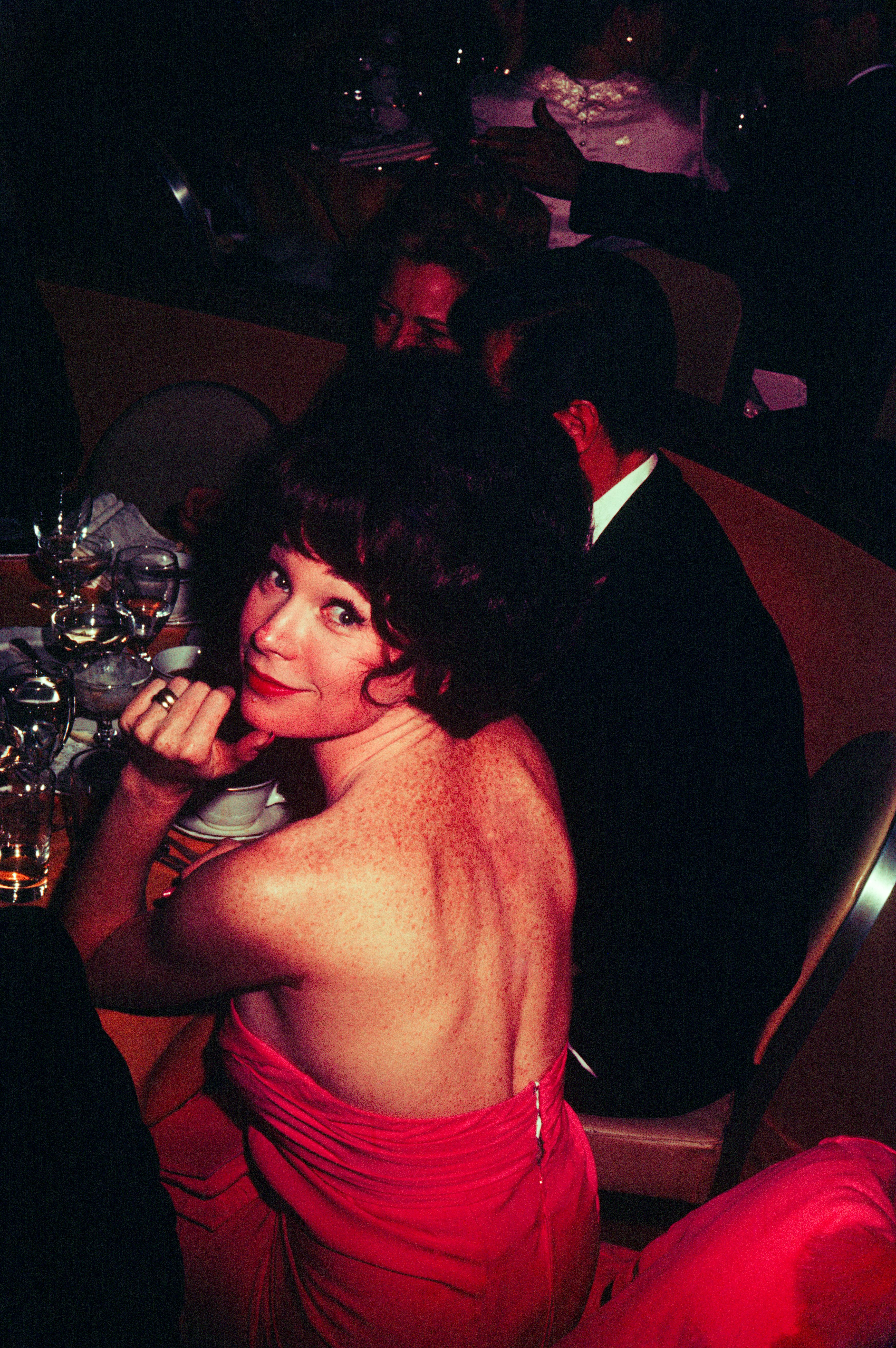 Shirley MacLaine looking over her shoulder at a formal dinner, circa 1970, in New York | Source: Getty Images
