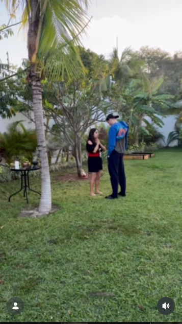 Presley Gerber stood outdoors on the grass beside a woman in a black dress with her hands held together, capturing a quiet, reflective moment in a video shared to his Instagram account from Cancún, Mexico. | Source: Instagram/presleygerber