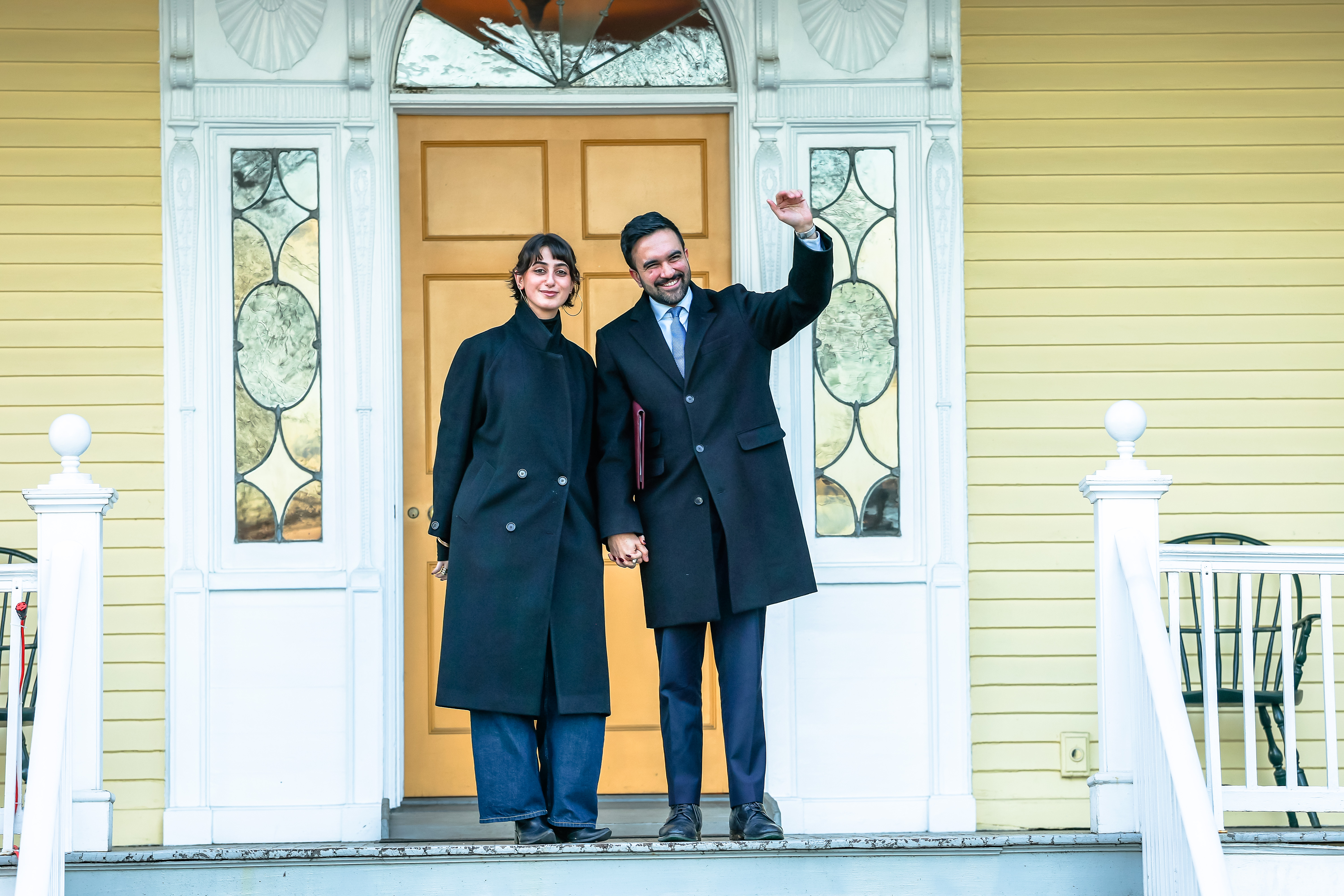 Rama Duwaji and Zohran Mamdani waving and posing for photos after a press conference during moving day at Gracie Mansion in New York City on January 12, 2026. | Source: Getty Images