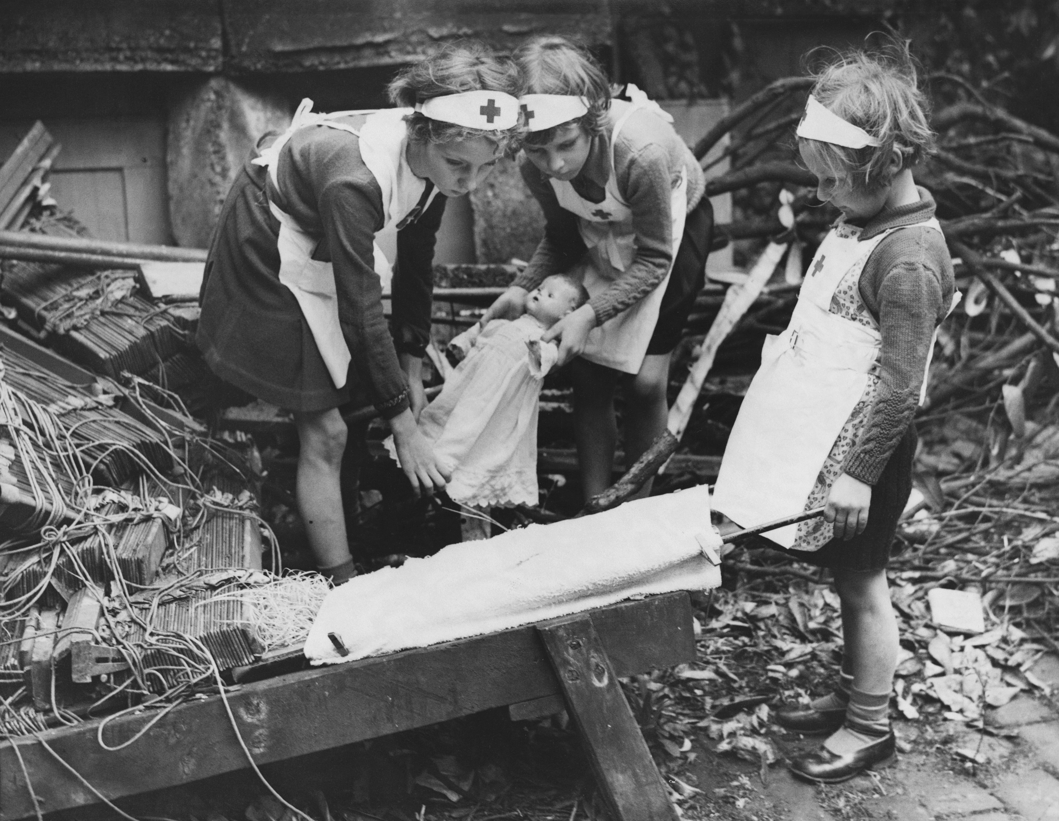 Girls practicing first aid in a bombed London yard | Source: Getty Images
