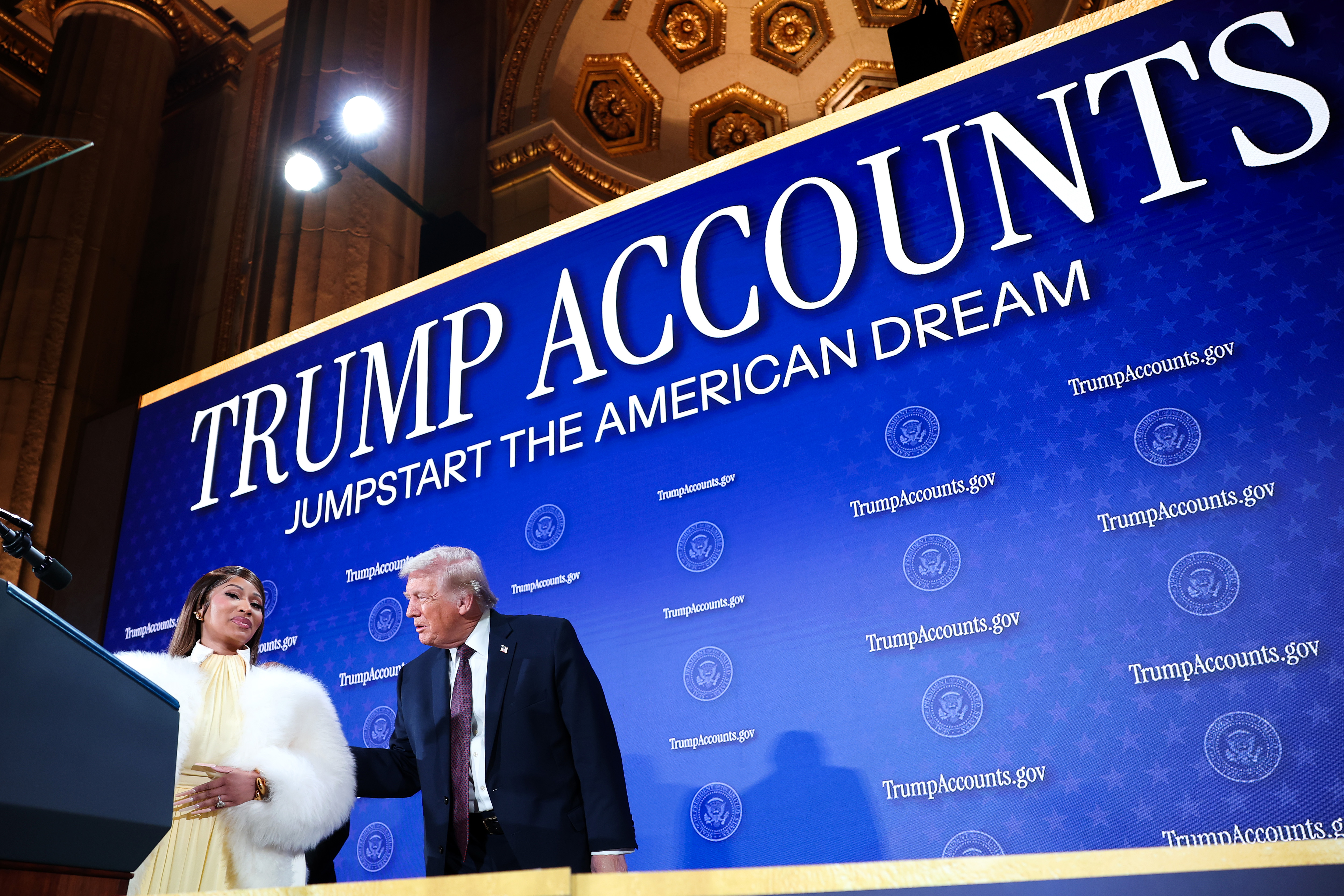 Nicki Minaj joins U.S. President Donald Trump on stage as he delivers remarks during the Treasury Department's Trump Accounts Summit at Andrew W. Mellon Auditorium on January 28, 2026, in Washington, DC | Source: Getty Images