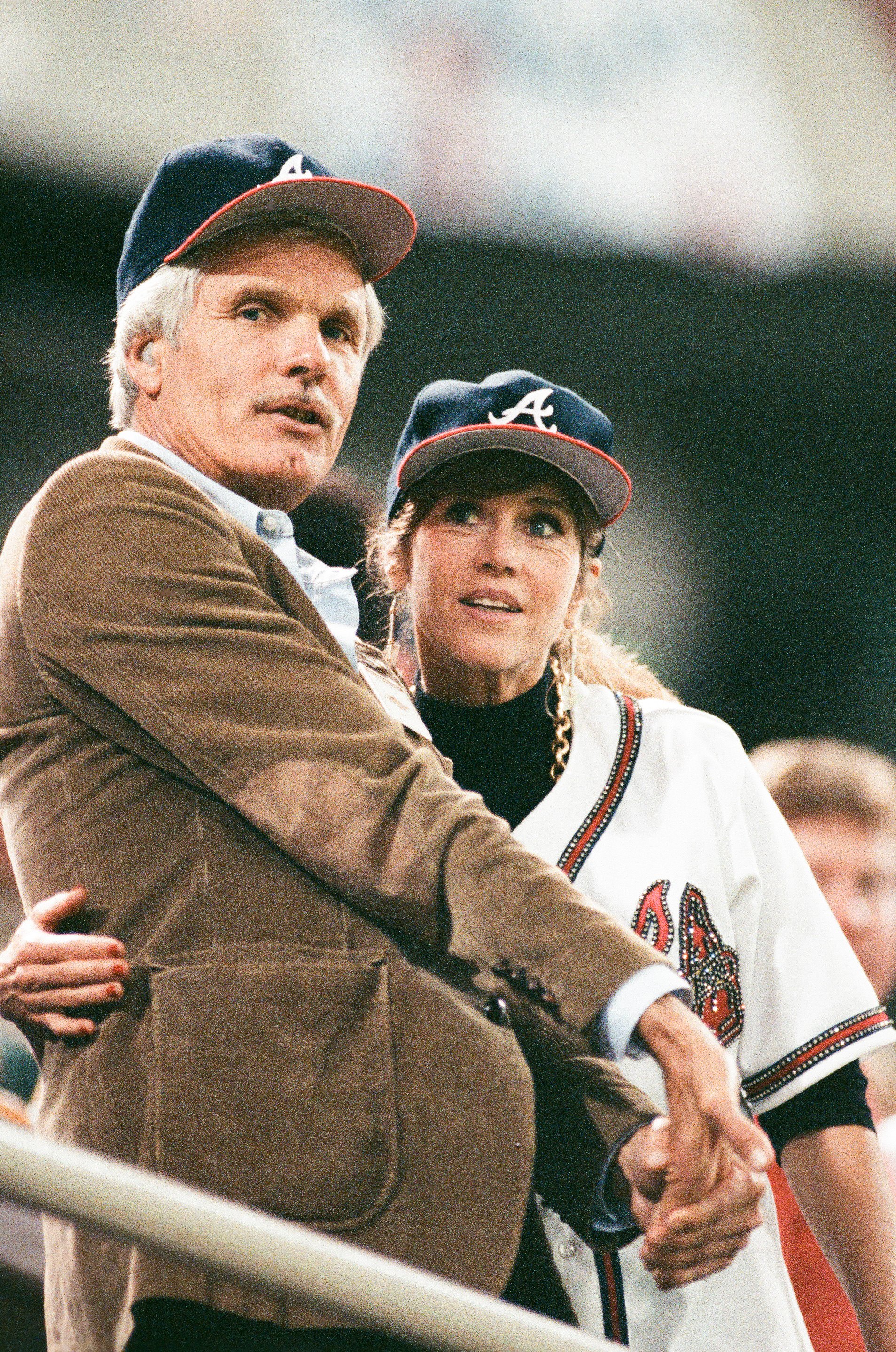 Ted Turner and Jane Fonda attend a 1991 World Series game against the Minnesota Twins at the Hubert H. Humphrey Metrodome in Minneapolis, Minnesota | Source: Getty Images
