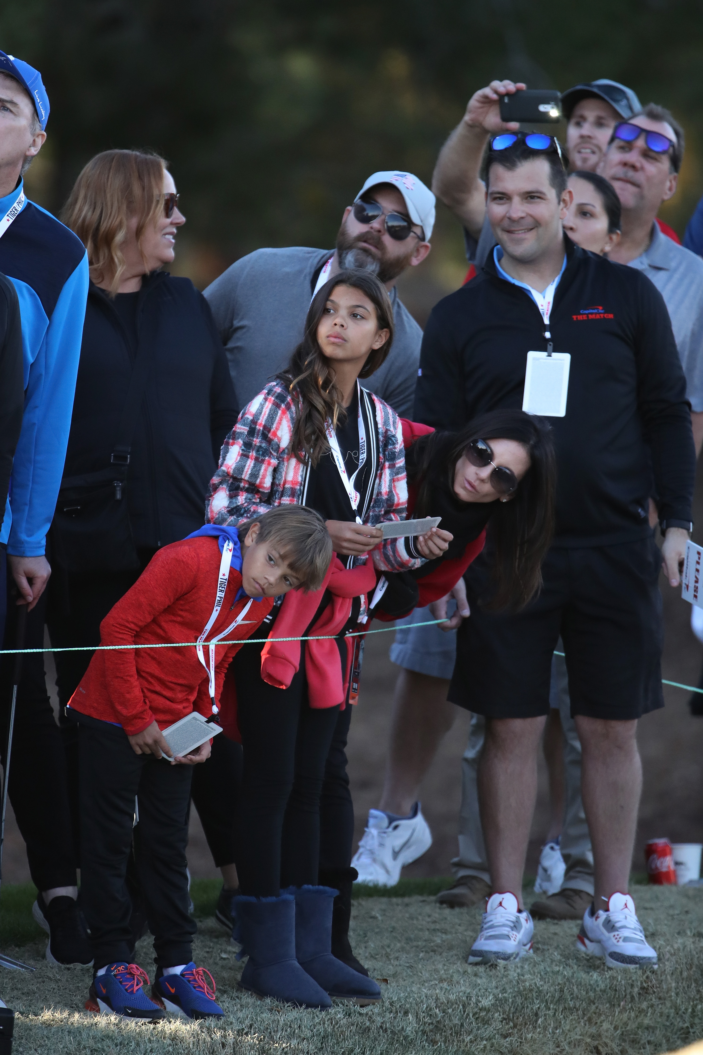 Erica Herman, Sam Woods, and Charlie Woods look on during The Match: Tiger vs Phil at Shadow Creek Golf Course on November 23, 2018, in Las Vegas, Nevada | Source: Getty Images
