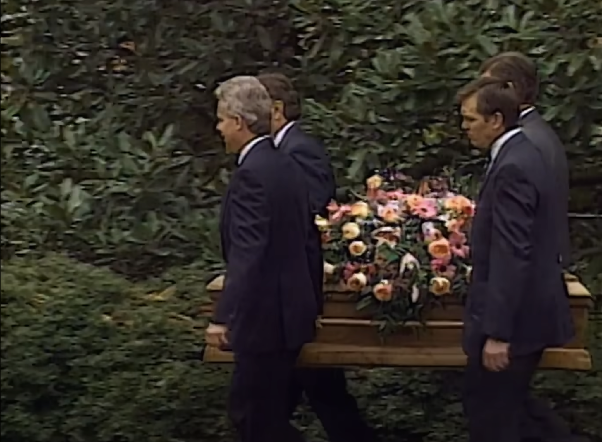 Men carrying JonBenét Ramsey's coffin from a video dated November 4, 2024. | Source: YouTube/Netflix