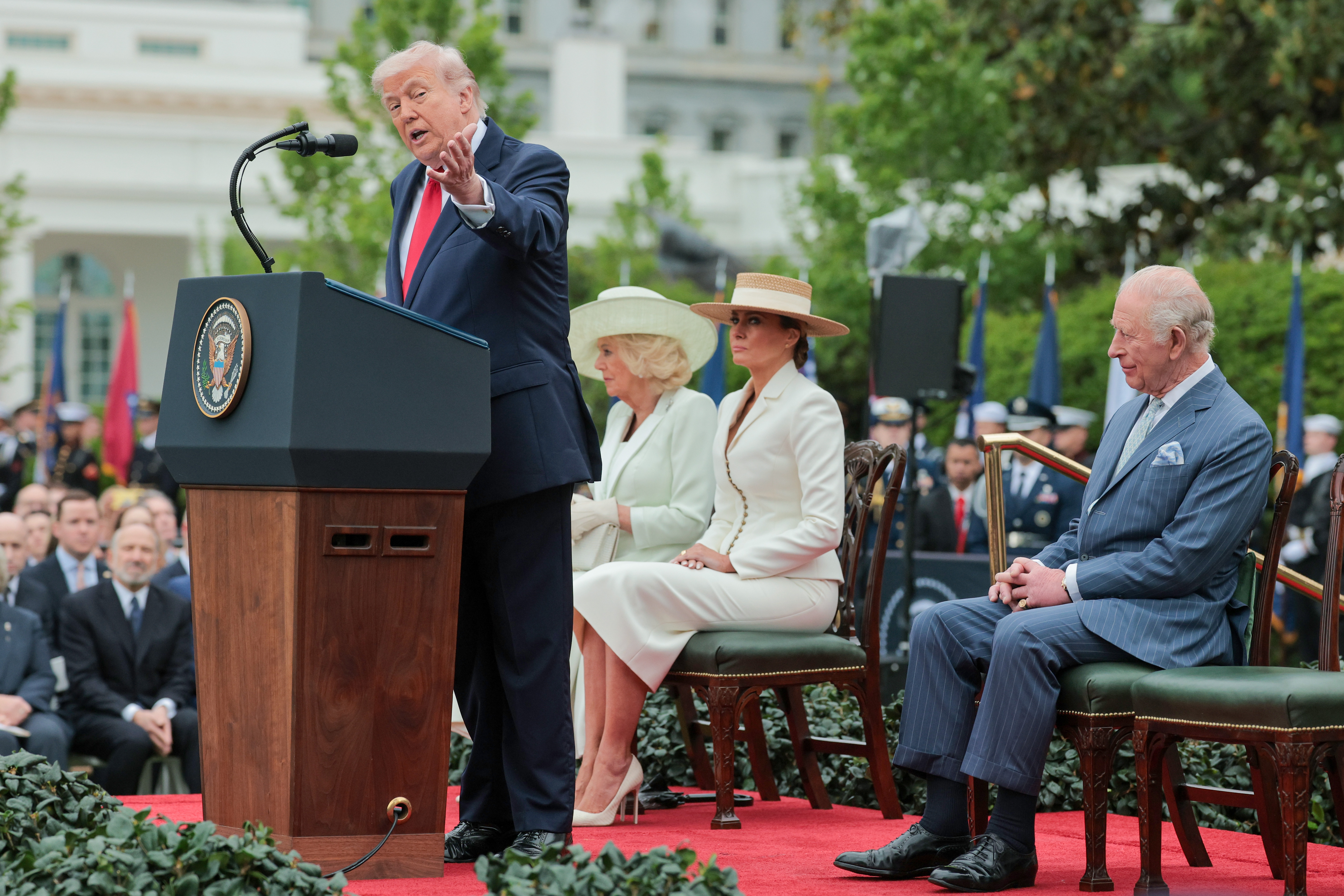 President Donald Trump speaks onstage with Queen Camilla, First lady Melania Trump, and King Charles III during a state arrival ceremony on the South Lawn of the White House on April 28, 2026 | Source: Getty Images