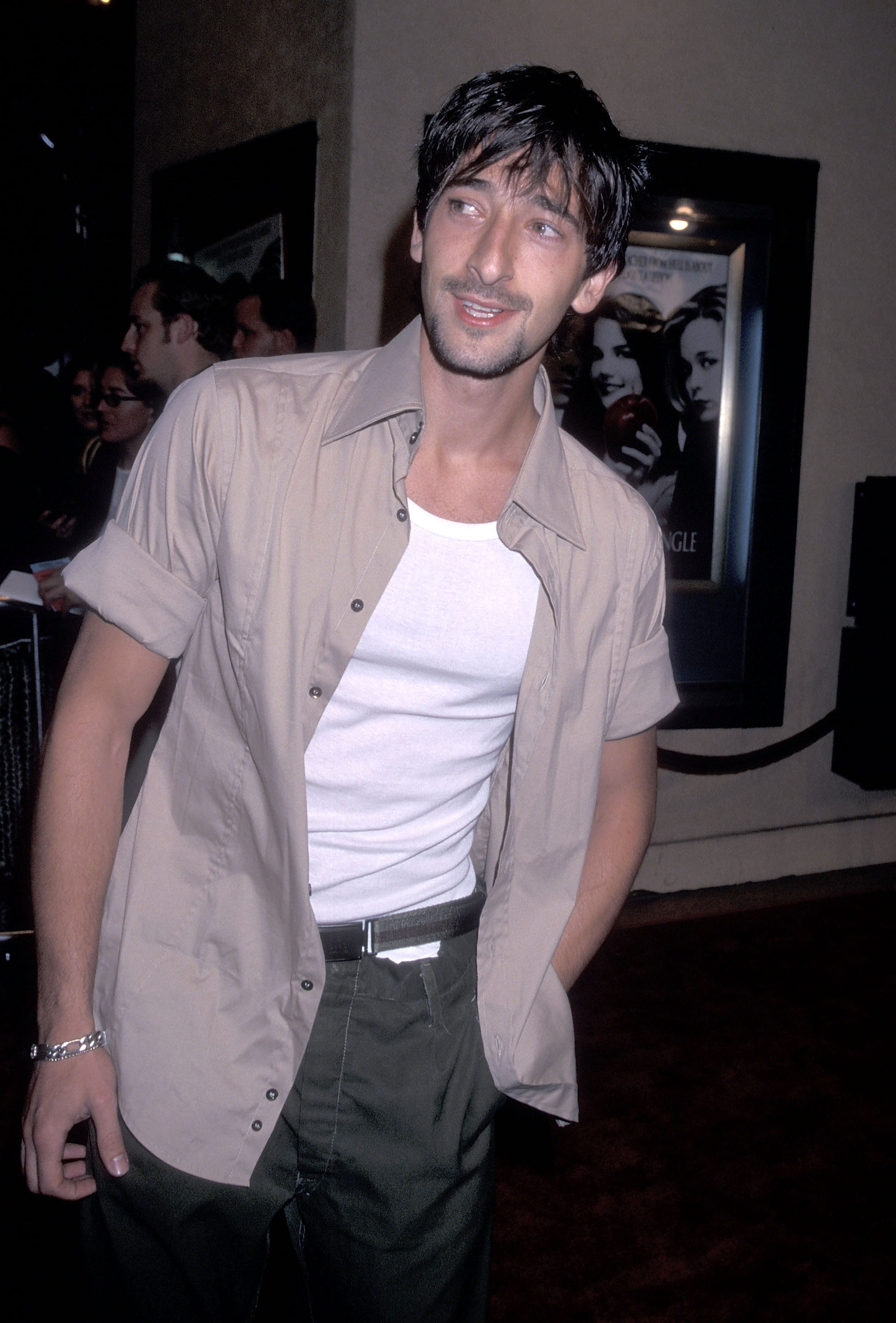 Adrien Brody kept his look casual for the Westwood premiere of "Teaching Mrs. Tingle" at the Mann Bruin Theatre in Westwood, California, on August 11, 1999, pairing a white tank top with an open short-sleeved shirt. Photographed nearly three years before "The Pianist" reached theaters, the actor still had a fuller frame than he would after losing about 30 pounds for the role of Władysław Szpilman.
