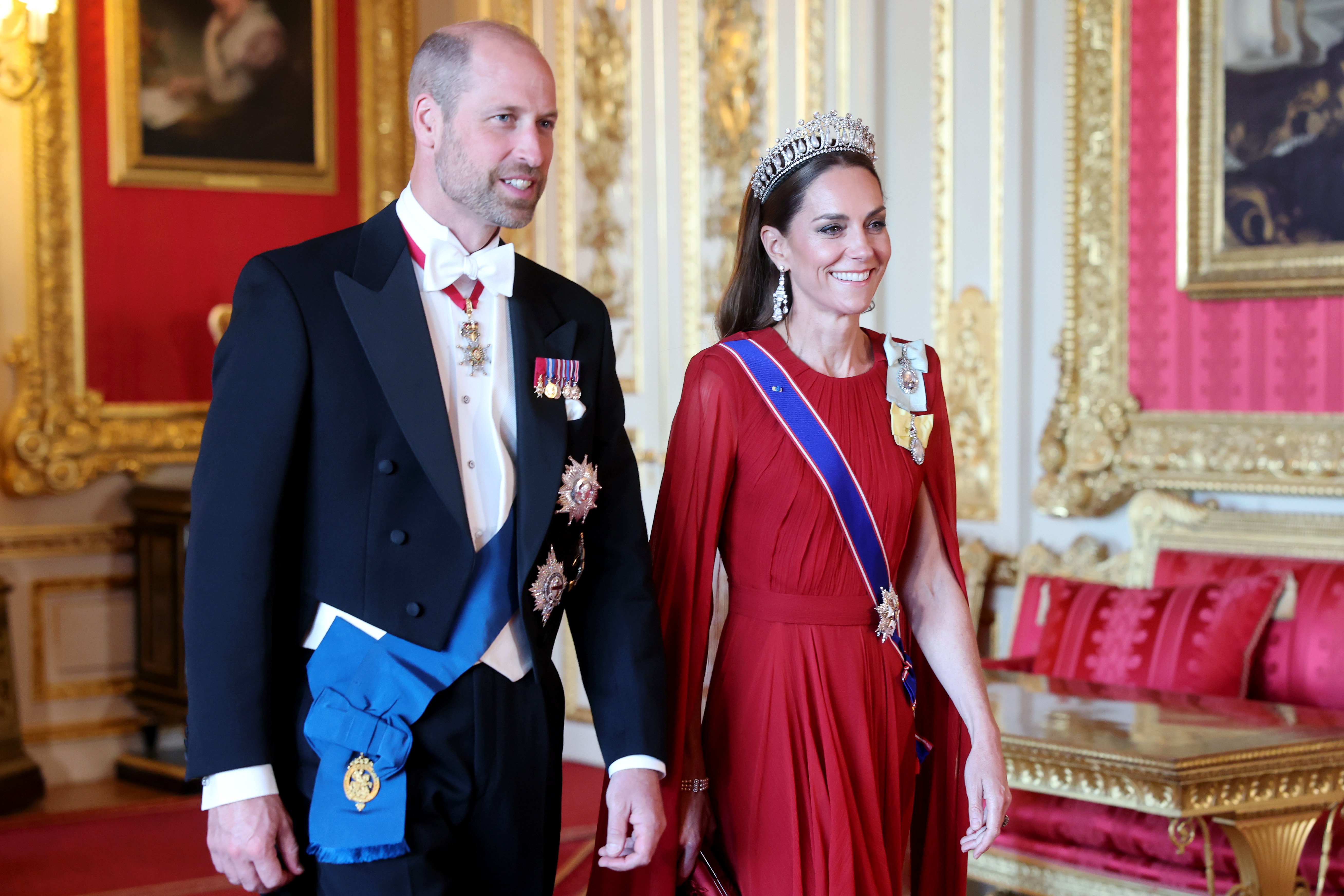 Prince William and his wife, Princess Catherine are all smiles as they attend the banquet held in honour of the Macrons.