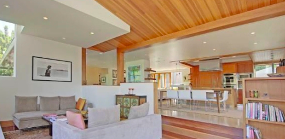 The house pairs clean contemporary lines with extensive woodwork rather than going for an all-white modern look. Its open arrangement also gives the main living spaces a relaxed, connected feeling.