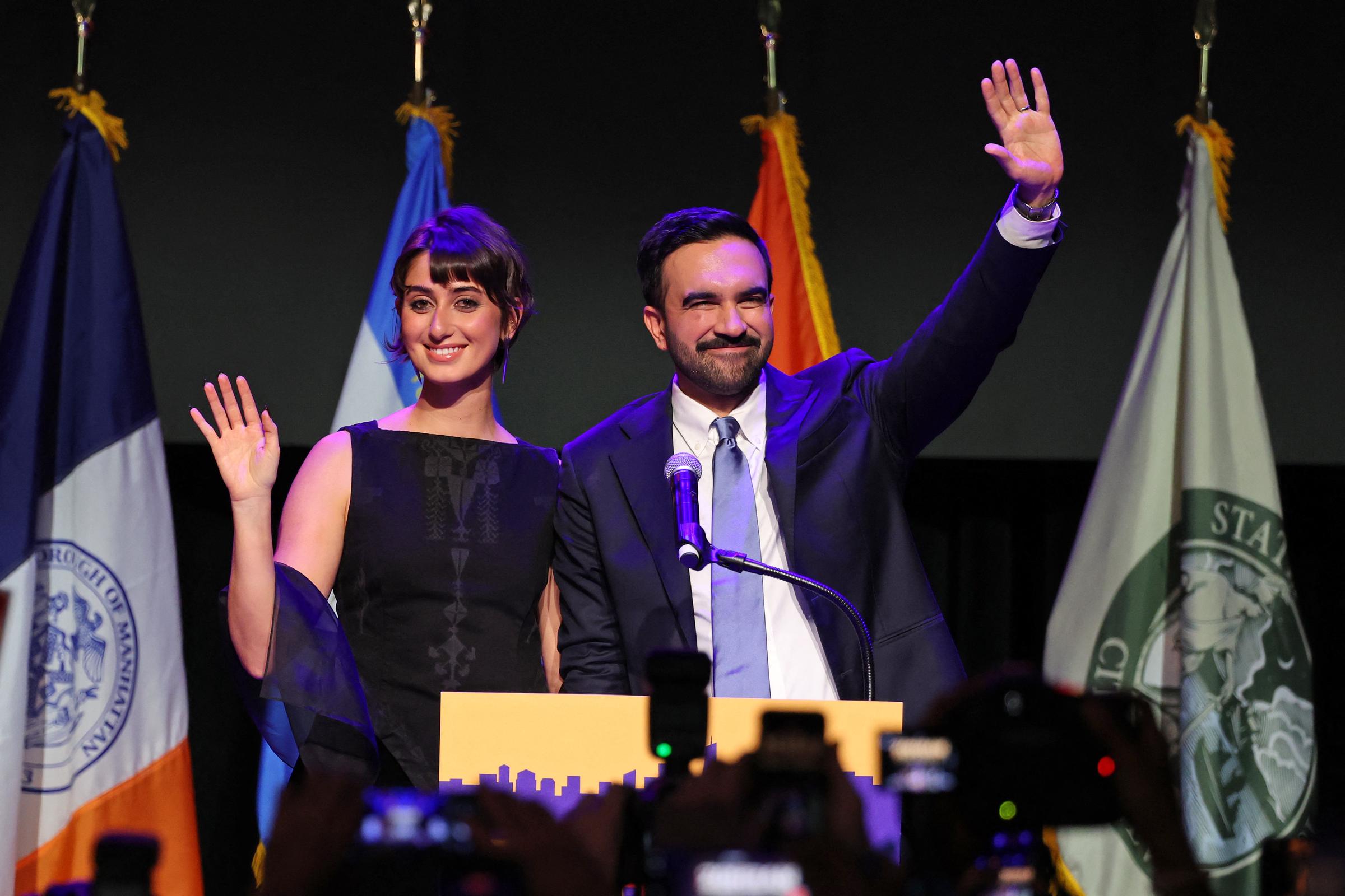 Rama Duwaji and Zohran Mamdani wave at onlookers during an election night event in Brooklyn, New York on November 4, 2025. | Source: Getty Images