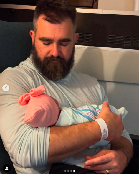 Jason Kelce holding his newborn daughter Finnley "Finn" Anne Kelce in his arms, posted on April 2, 2025. | Source: Instagram/kykelce